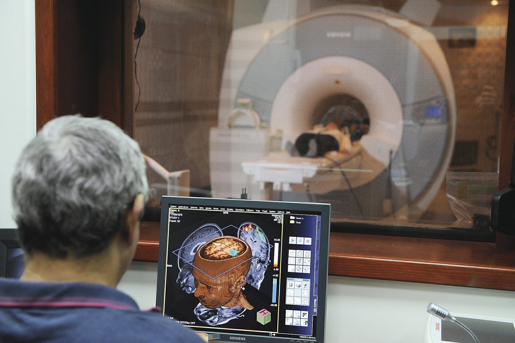 CUTTING EDGE: A Weizmann researcher studies MRI images that show brain activity in real time. The institute’s U.S. fundraising arm raises more than $60 million a year. 