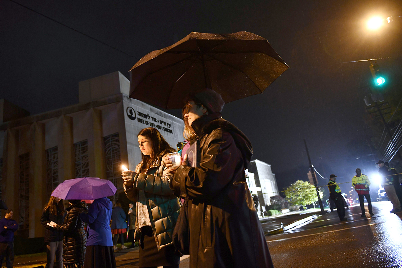 People gather outside the Tree of Life Synagogue after a shooting there left 11 people dead.