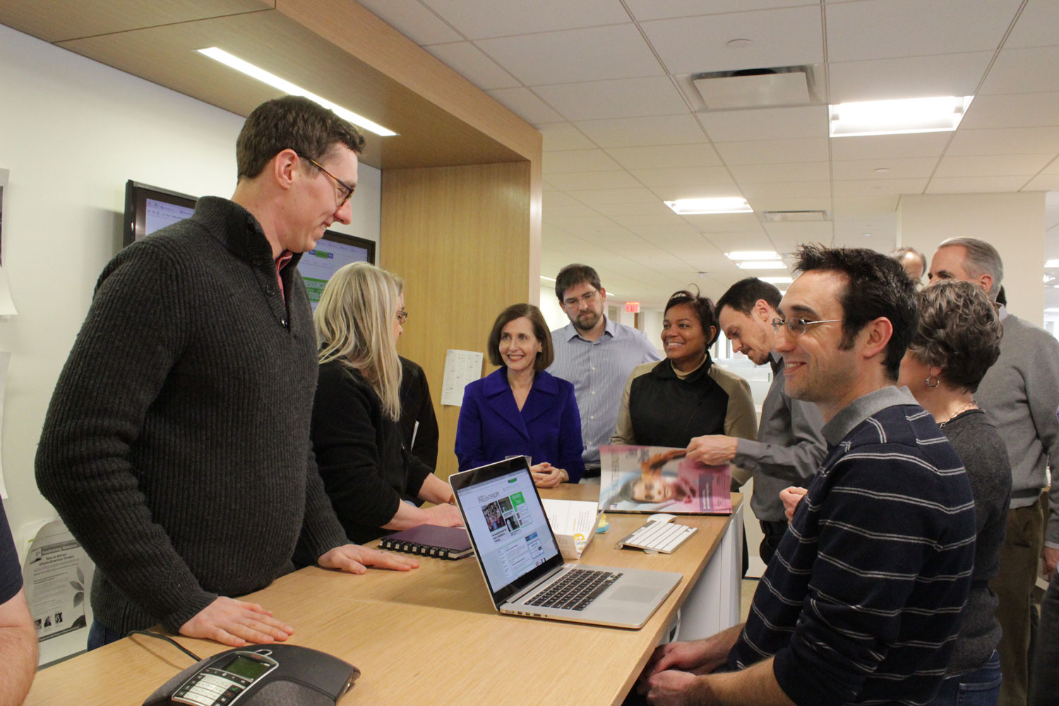 Senior Editor Cody Switzer (front left) and Manager of Product Engineering Matt Good (front right) work with colleagues on the finishing touches of our print and online reinvention.