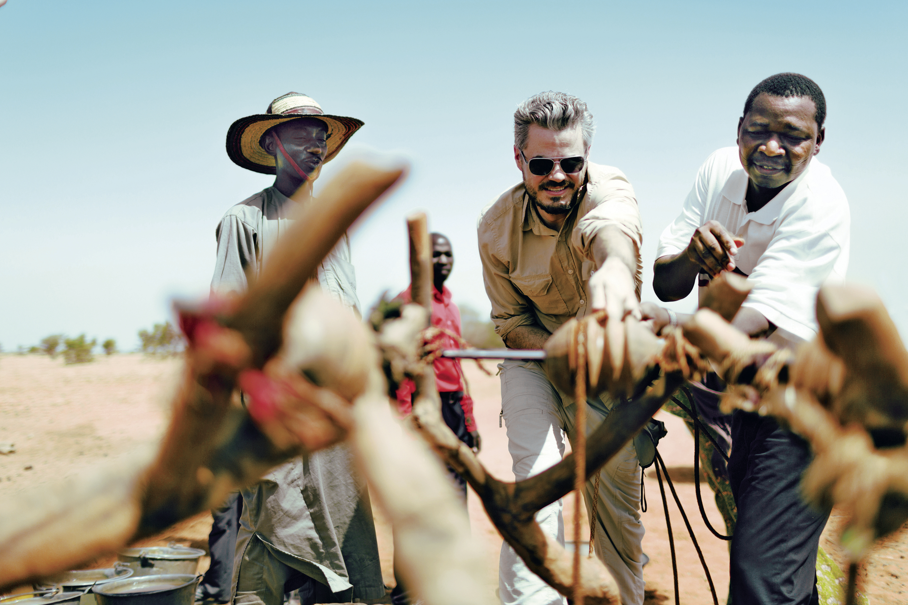 Scott Harrison of Charity: Water (center, visiting a project site in Niger) says his organization aims to engage people too skeptical to give to traditional nonprofits. His new memoir recounts how he built his organization from scratch.