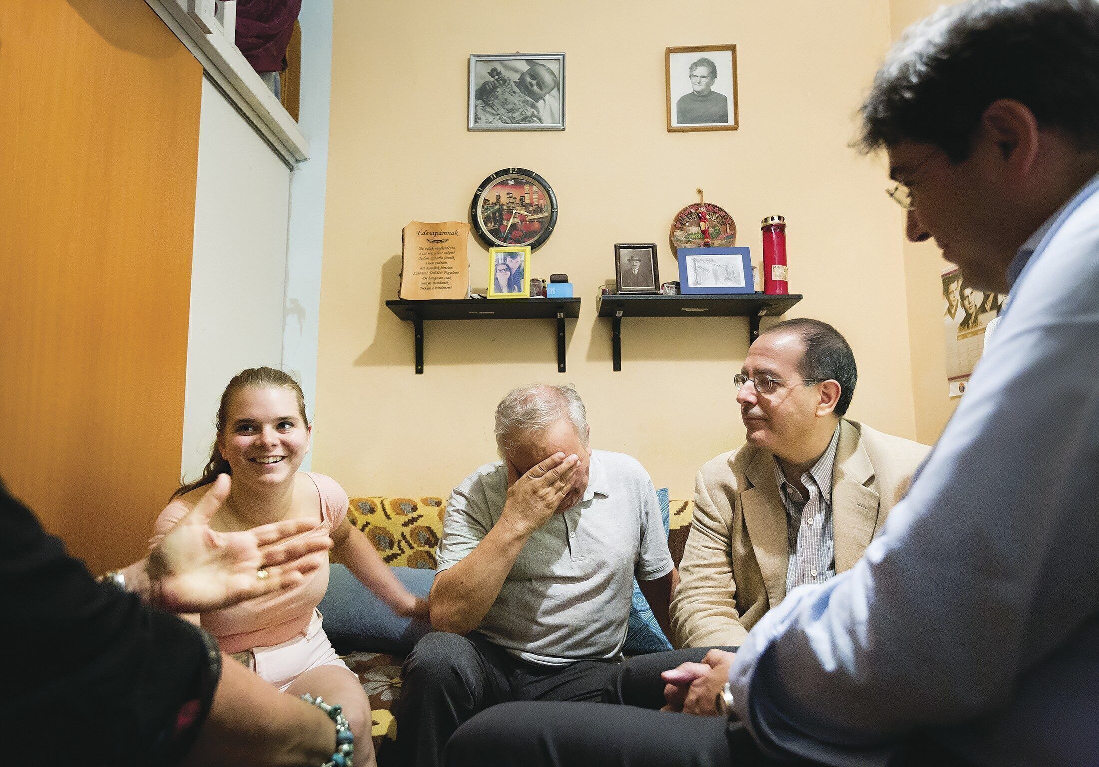 A HANDS-ON APPROACH: David Schizer (second from right), the new leader of a Jewish aid charity, is traveling to learn how the organization can adapt to a changing world. Here, he meets a Budapest family that benefitted directly from his charity’s efforts. 
