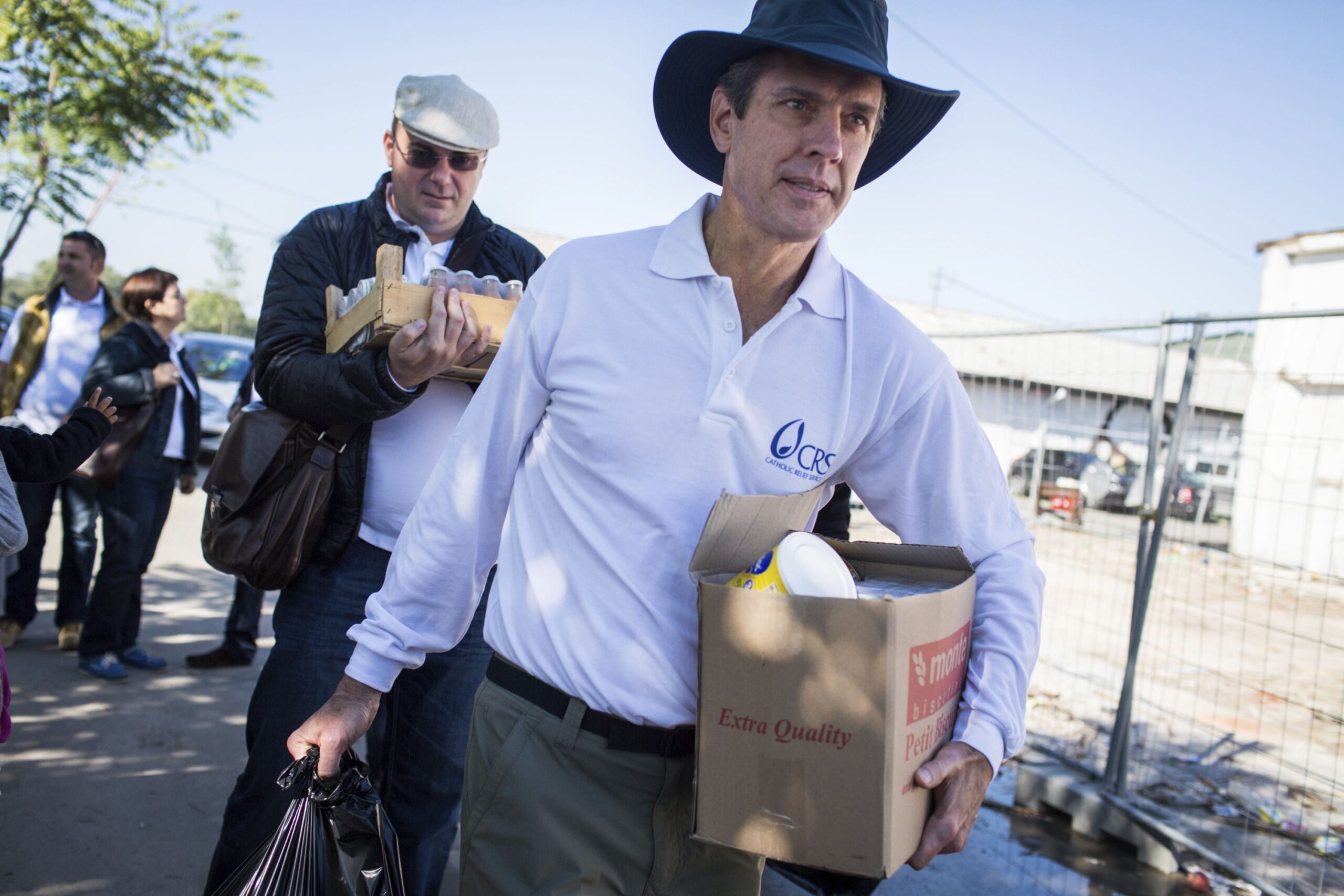 FOCUSED COMMITMENT: Catholic Relief Services chief executive Sean Callahan has traveled the world for the organization since he started working there as a fellow in 1988. Here he is shown with program manager Dino Mujanovic, in Belgrade, Serbia, with supplies for refugees who are crossing into Croatia. 