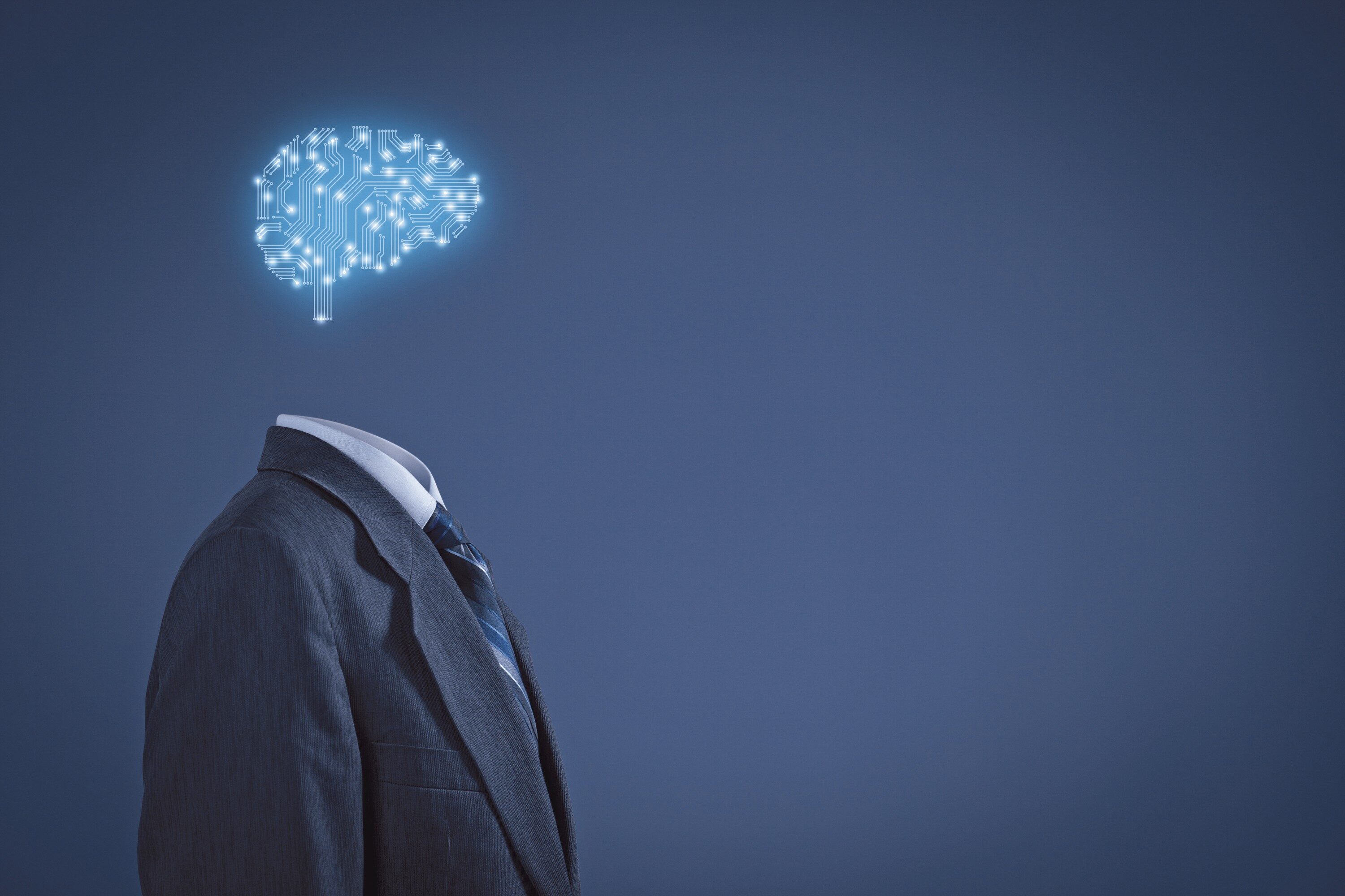 Artificial intelligence (AI), data mining, expert system software, genetic programming, machine learning, deep learning, neural networks and another modern computer technologies concepts. Brain representing artificial intelligence with printed circuit board (PCB) design.