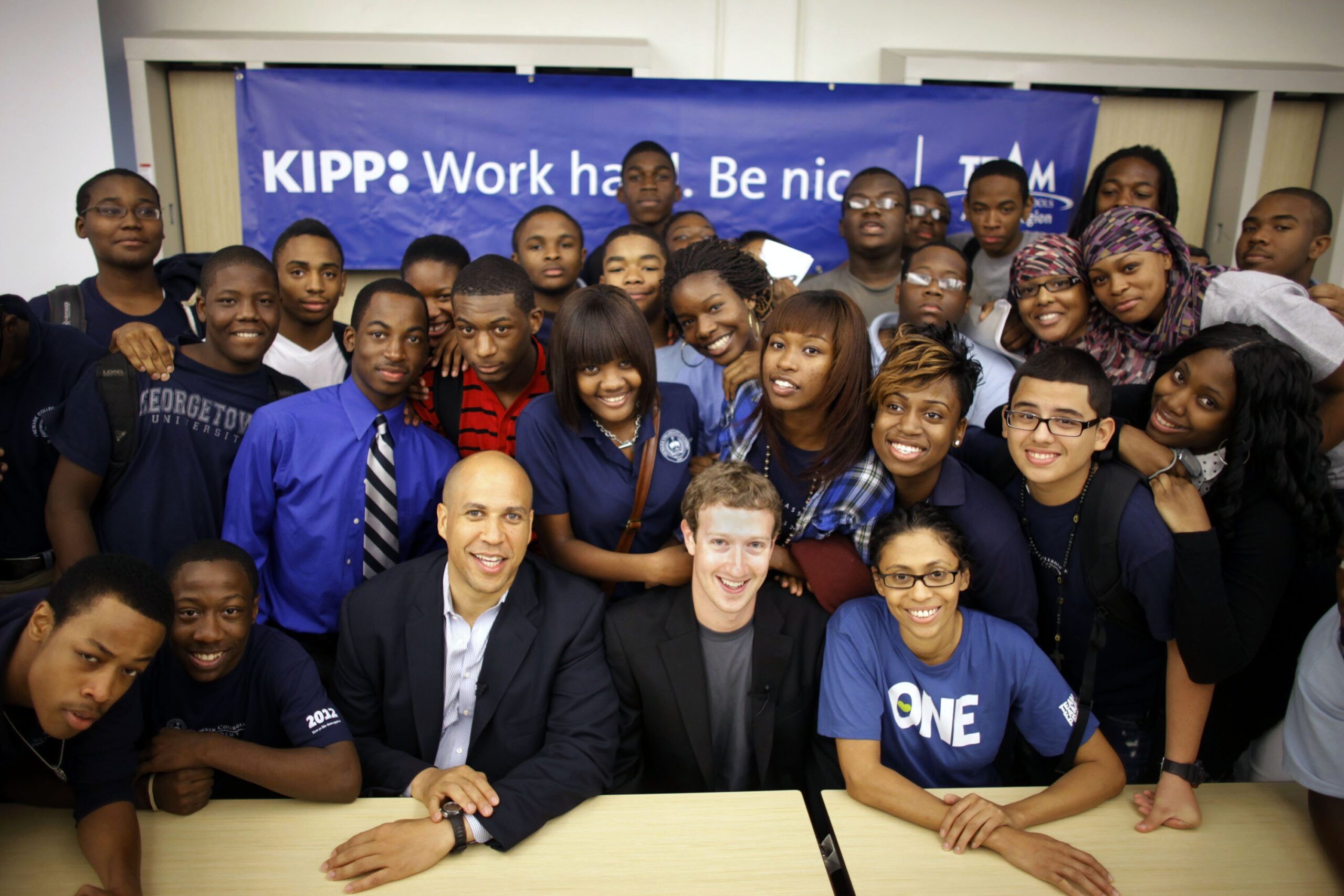 Former Newark Mayor Cory Booker (seated, center) is a gifted fundraiser with a flair for conveying the drama of life in the city's streets, according to a new book about the 2010 gift of $100 million for Newark's public schools from Mark Zuckerberg (seated, second from the right).