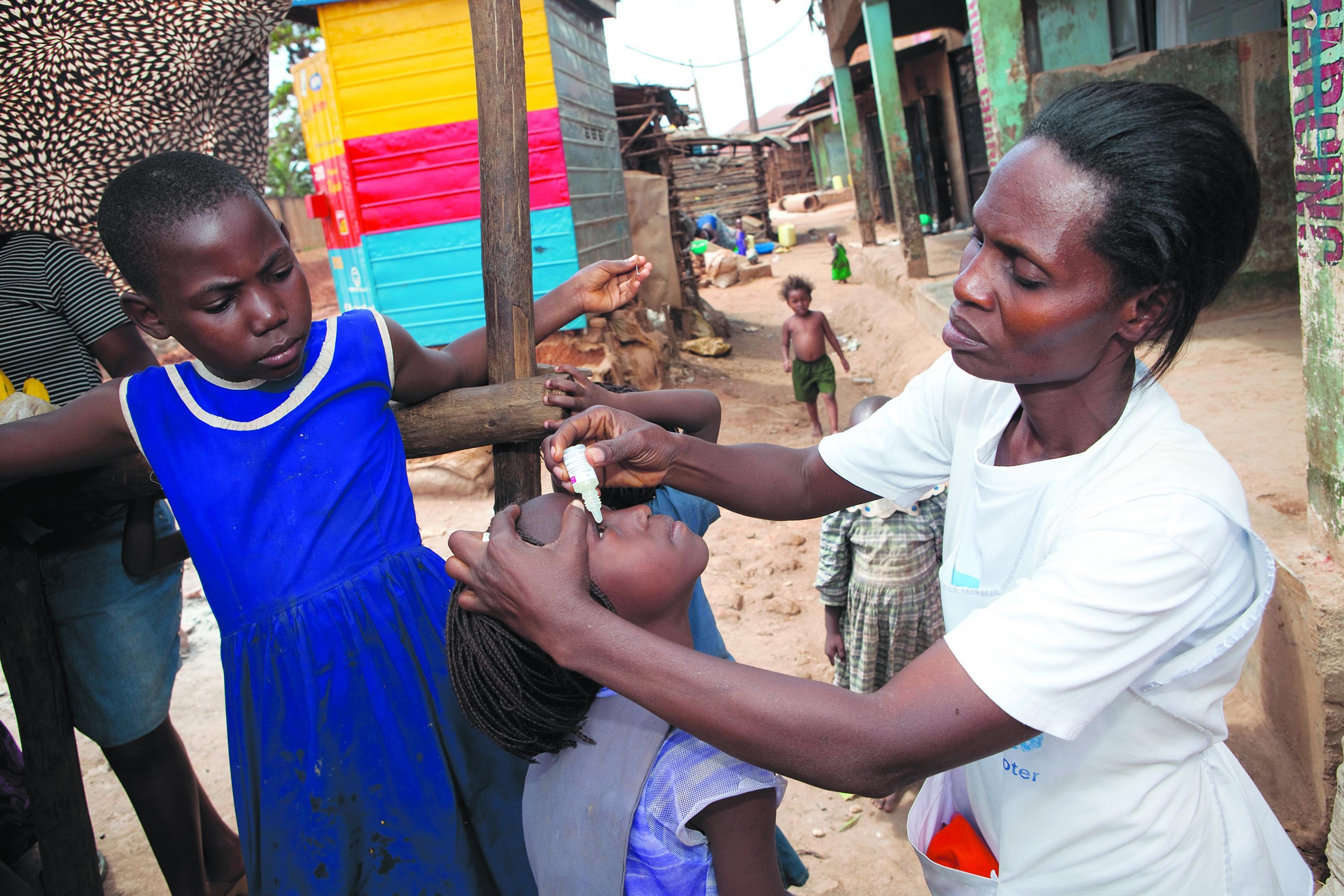 DOOR-TO-DOOR Rx: A worker with Living Goods, an international health charity, works with a patient in Uganda.