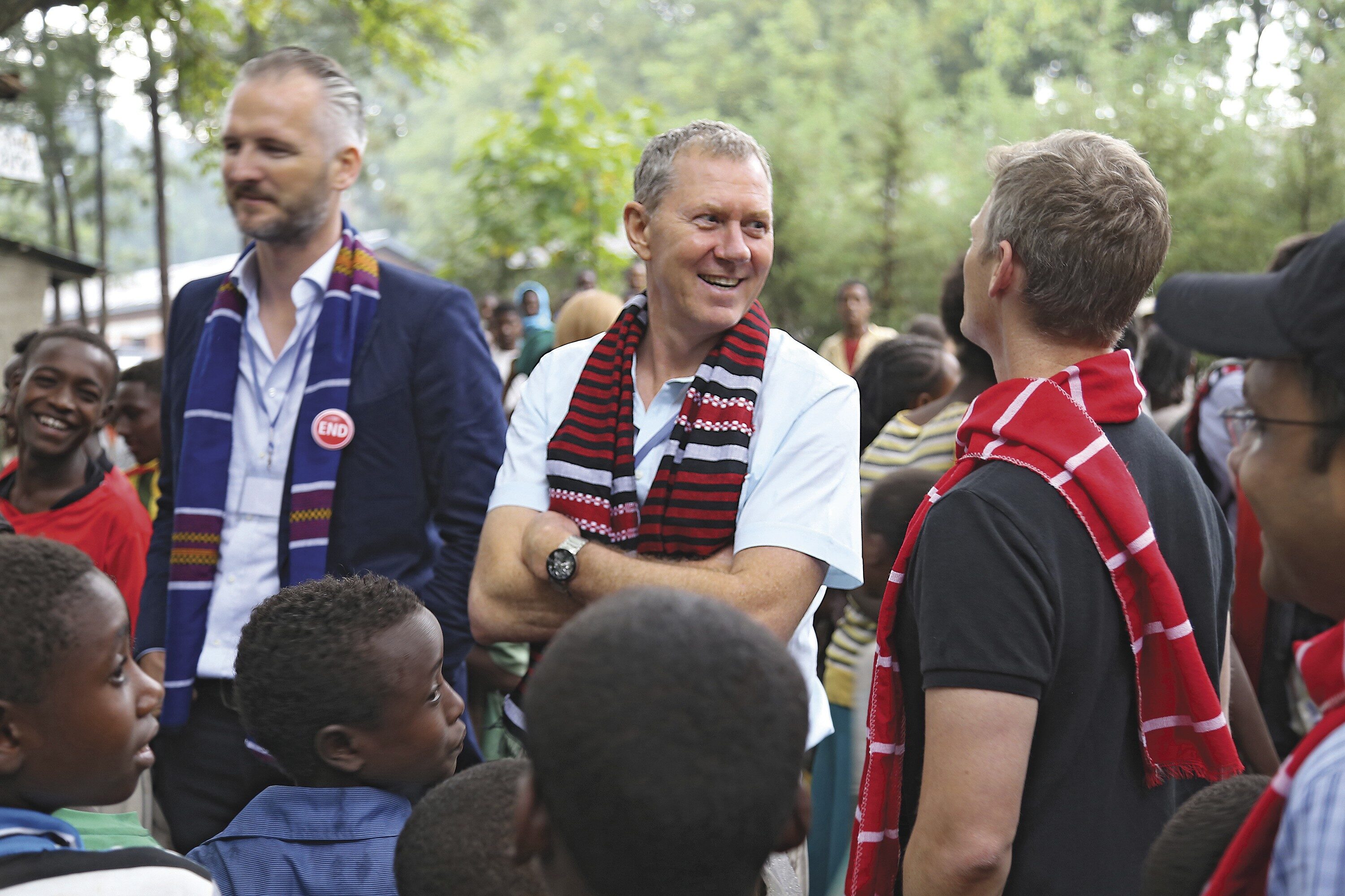 AID BUSINESS: Doug Balfour (center) visits a program in Ethiopia managed by his company, Geneva Global. The philanthropic consultancy takes an investment-firm approach to international development, building nine-figure funds to tackle disease, human trafficking, and other ills.