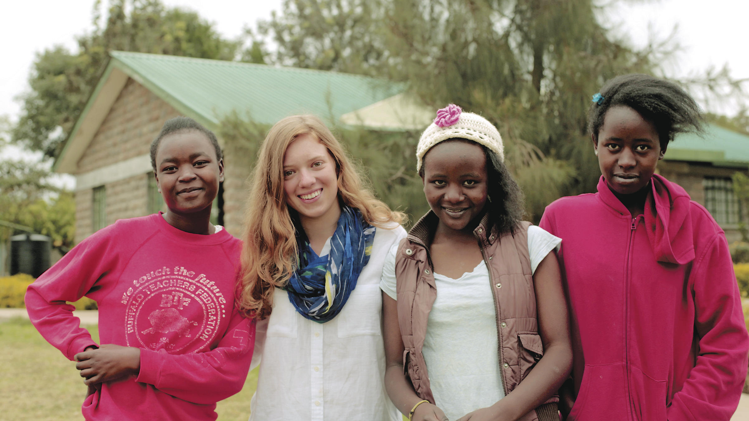 Mary Grace Henry, second from left, has raised $200,000 to help 66 girls get an education by designing and selling hair accessories.