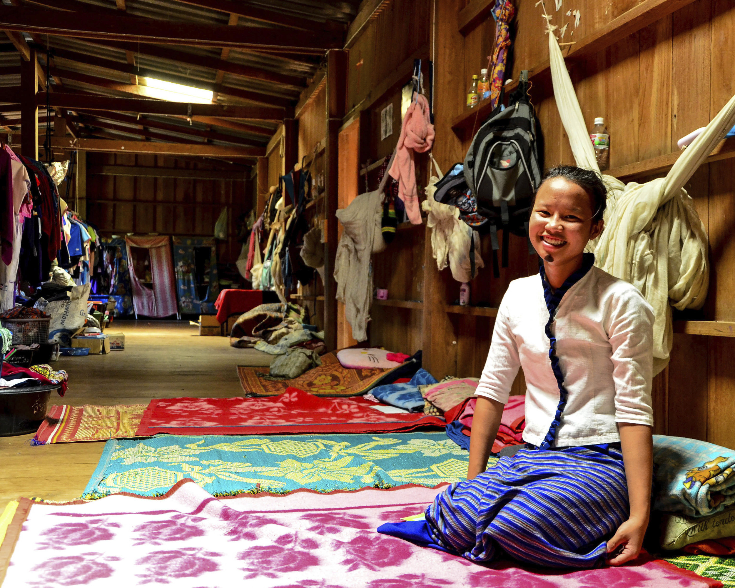 Nuda Klogdaranee, 14, lives in a boarding house in a village in Thailand. She shares the dormitory with about 60 other girls and sleeps under a mosquito net with two friends.