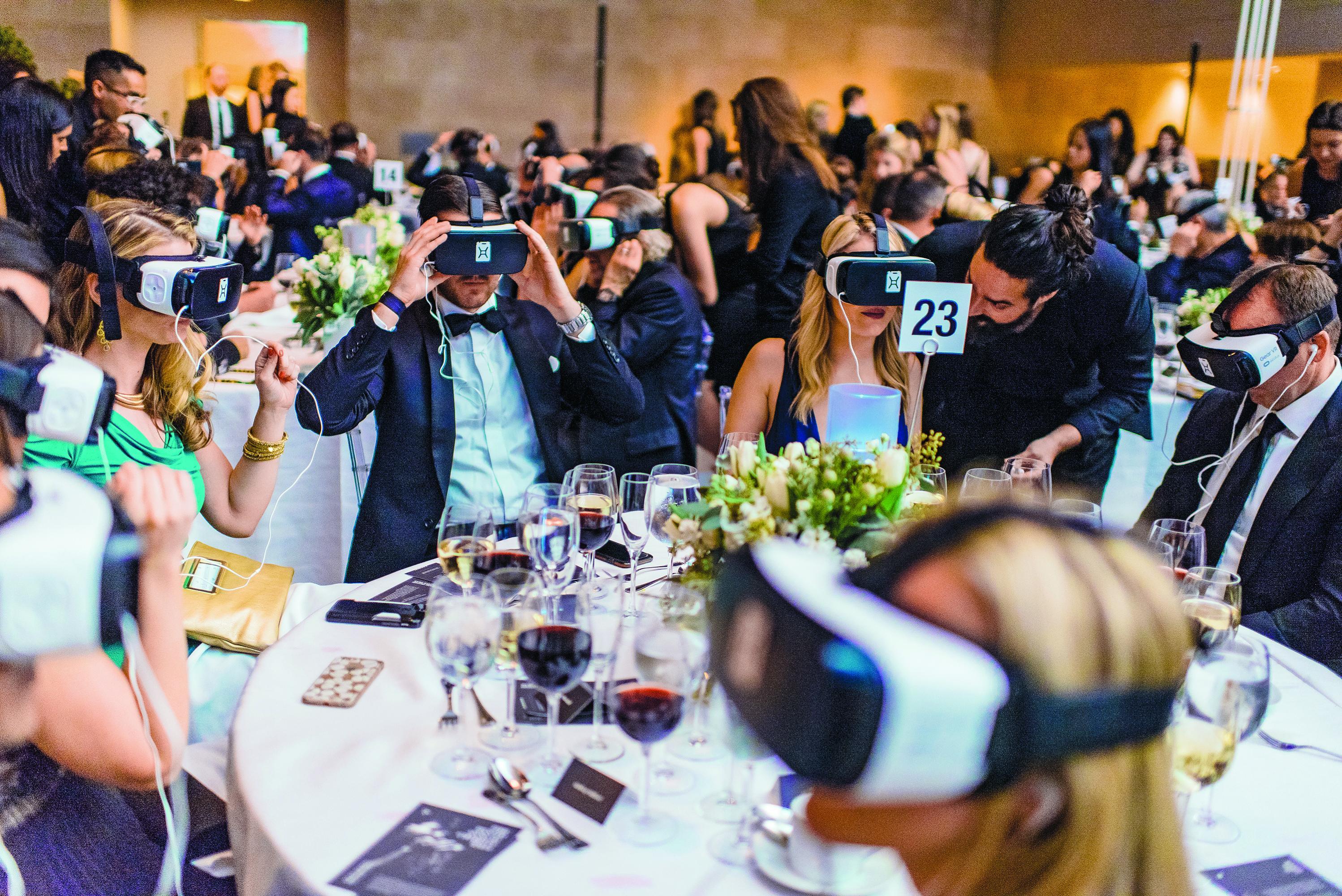 NEW GALA ACCESSORY: Guests at a Charity: Water gala in December donned headsets to watch a virtual-reality film that shows how digging a well in a village in Ethiopia changed the life of a 13-year-old. 