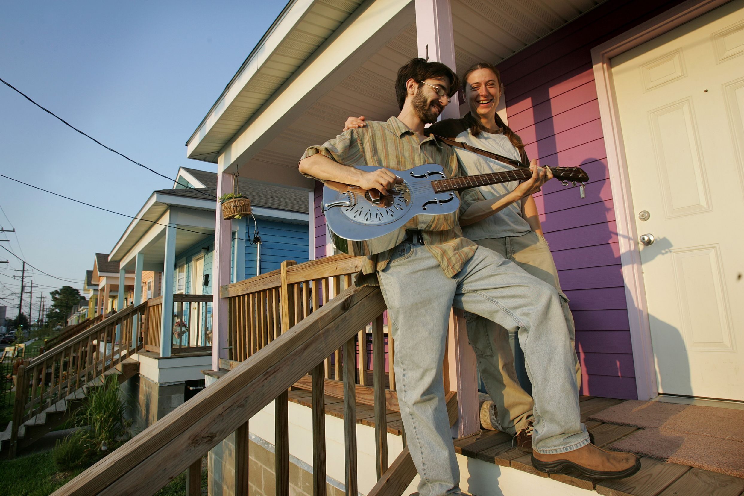 Adam Crochet, 28, left, and his girlfriend Boyanna Trayanova, 26, in front of their new home developed by the local branch of Habitat for Humanity.
