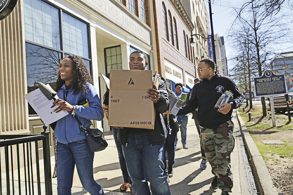 DIGGING INTO HISTORY: College students are among the volunteers who collect soil samples that will be incorporated into a national memorial to the victims of lynching.