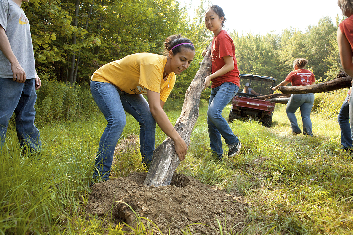 Incoming Cornell University students install fence posts at a horse-rescue center in Newfield, N.Y. Community service is part of the Cornell Tradition fellowship program, which retail magnate and “giving while living” advocate Charles Feeney made the focus of his final charitable donation.