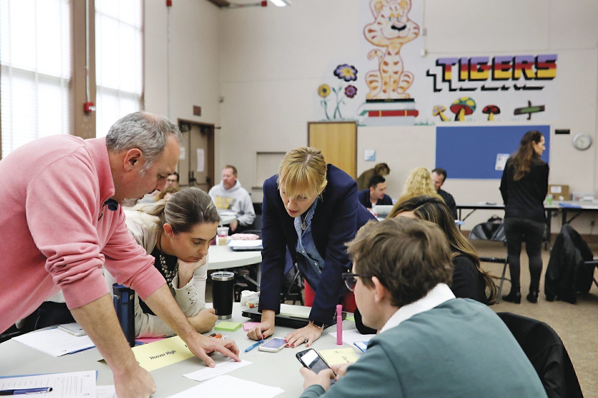 The Raikes Foundation helped Equal Opportunity Schools build a research and development unit to figure out how best to help students of color and students from low-income schools thrive. Here, San Diego school leaders collaborate to devise smart approaches.