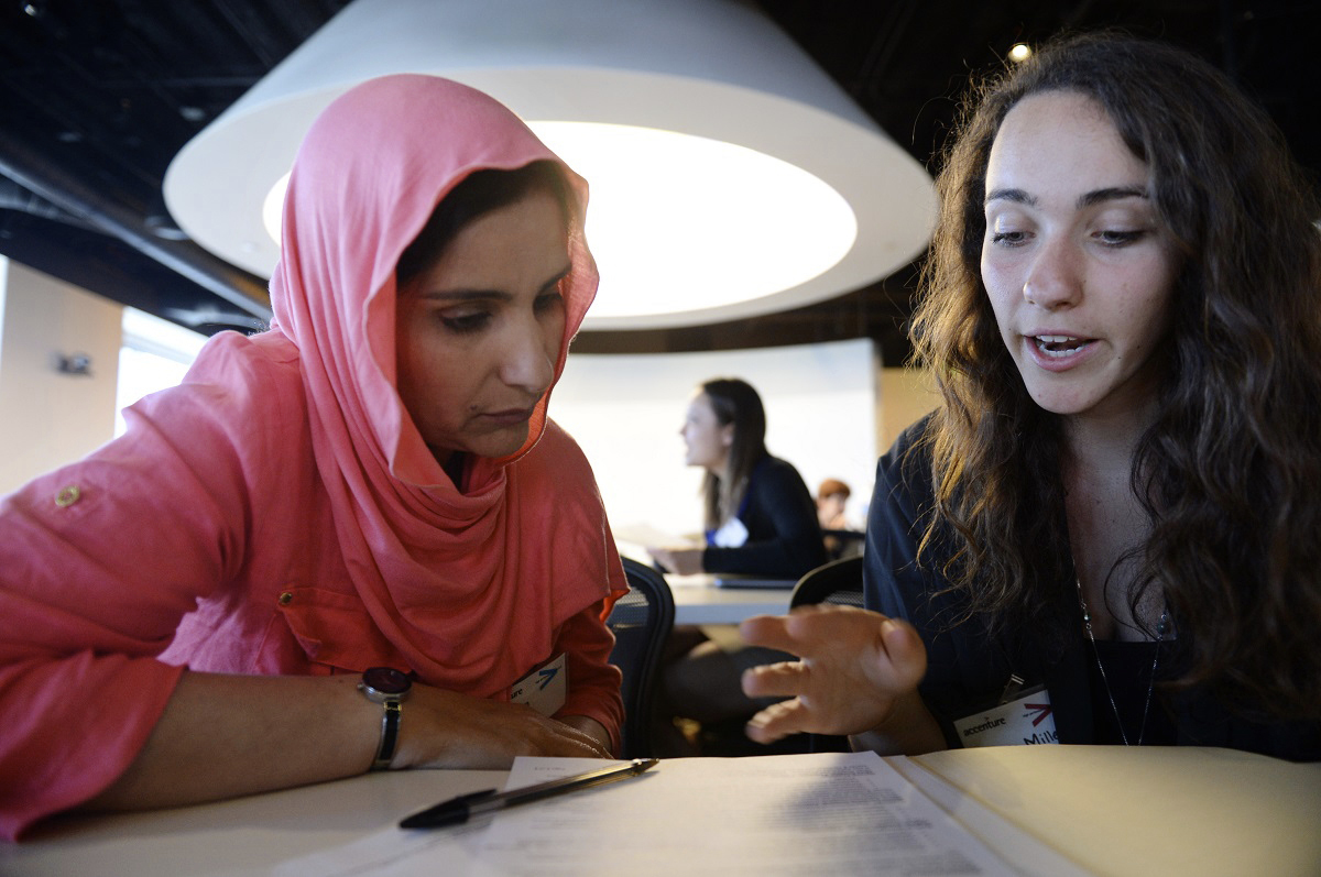 Upwardly Global volunteers help recent immigrants with job applications and mock interviews.