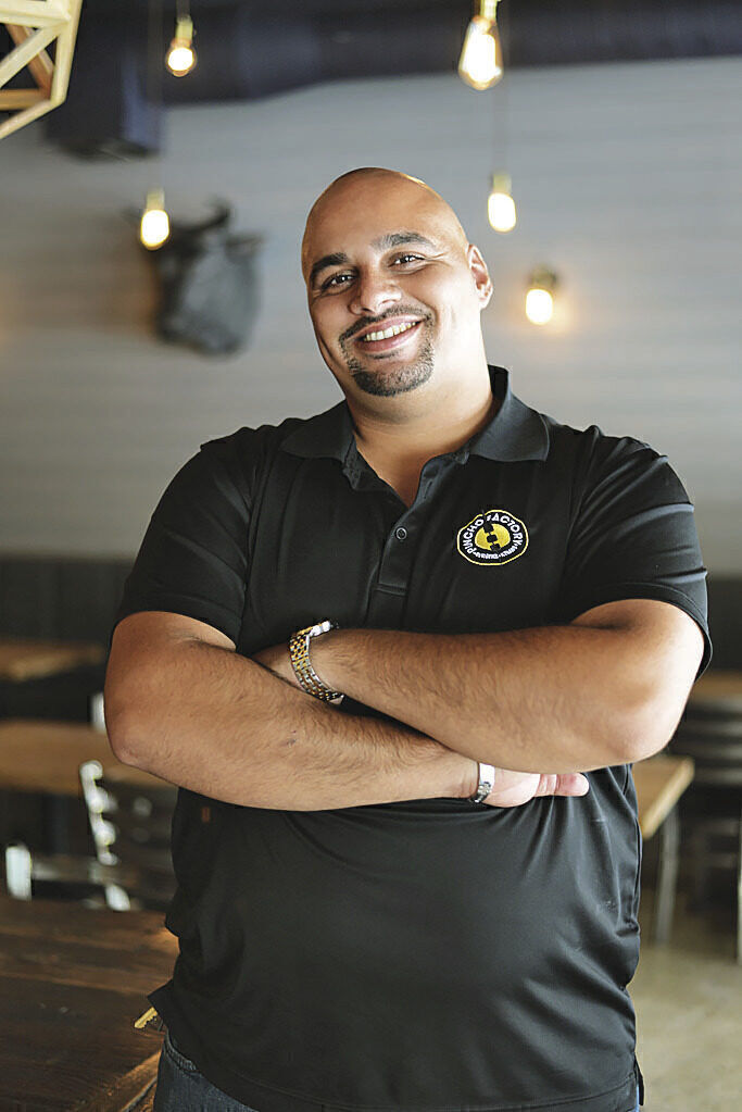 BOOSTING CAPITALISM: Nedal Ahmad is co-founder of Pincho Factory, a Florida restaurant chain backed by Endeavor, an Omidyar-supported nonprofit. Endeavor encourages for-profit entrepreneurship to drive economic growth.