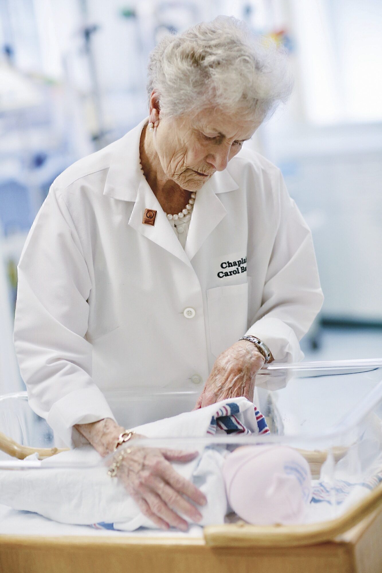 Carol Bauer is often called into the hospital at random hours to help
families dealing with the stress of newborns with severe health problems.