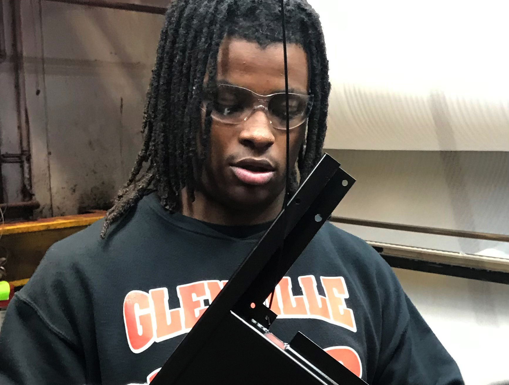 Kyren Lewis performs a quality inspection of painted sheet metal as part of his high school internship program, Early College, Early Career, where students divide time between school and training in manufacturing. Kyren is a senior at Ginn Academy in Cleveland, and is an apprentice at Lincoln Electric in Euclid, Ohio.