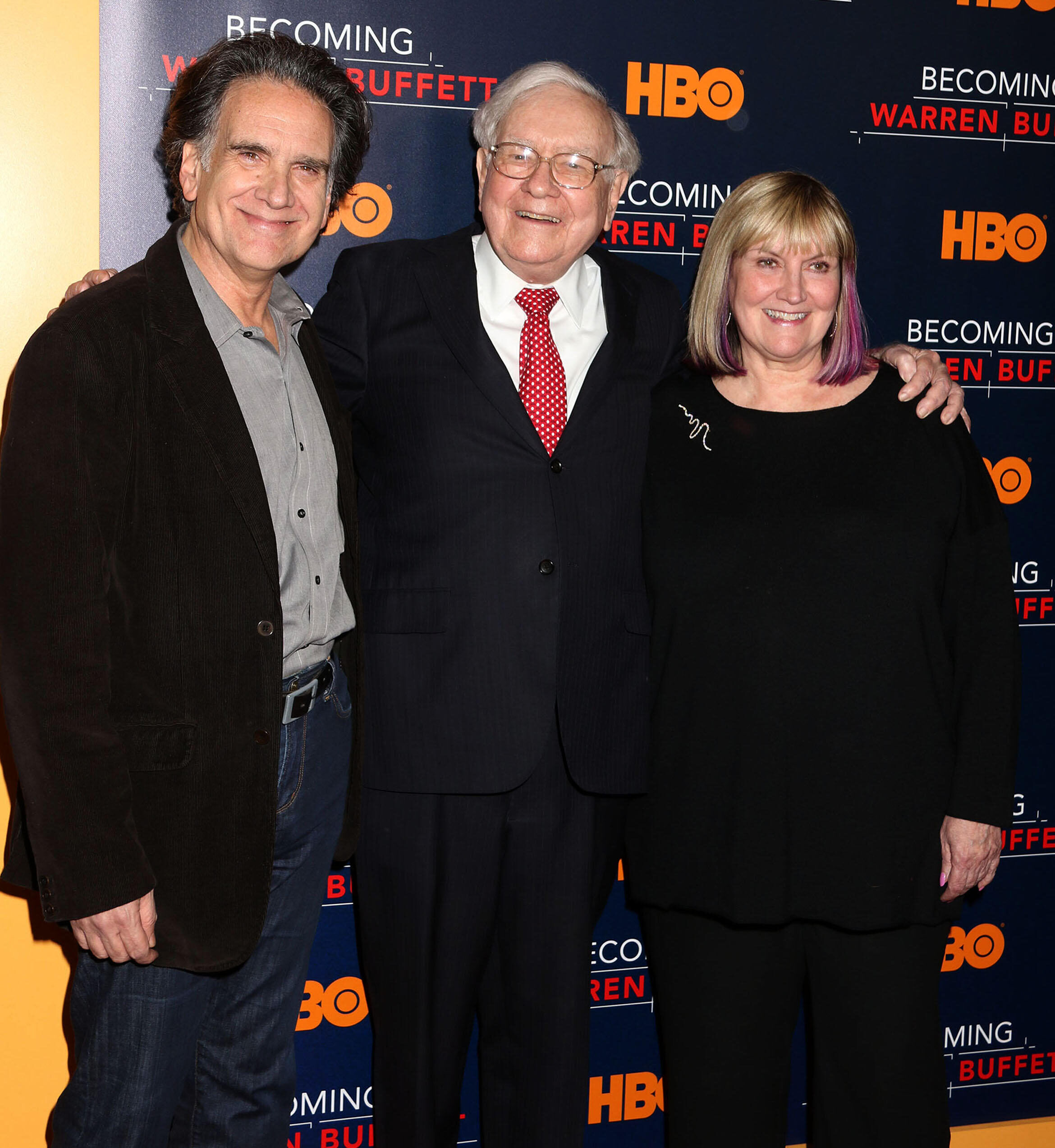 Warren Buffett (center) with his children Susie and Peter at the 2017 premiere of the HBO film “Becoming Warren Buffett.”