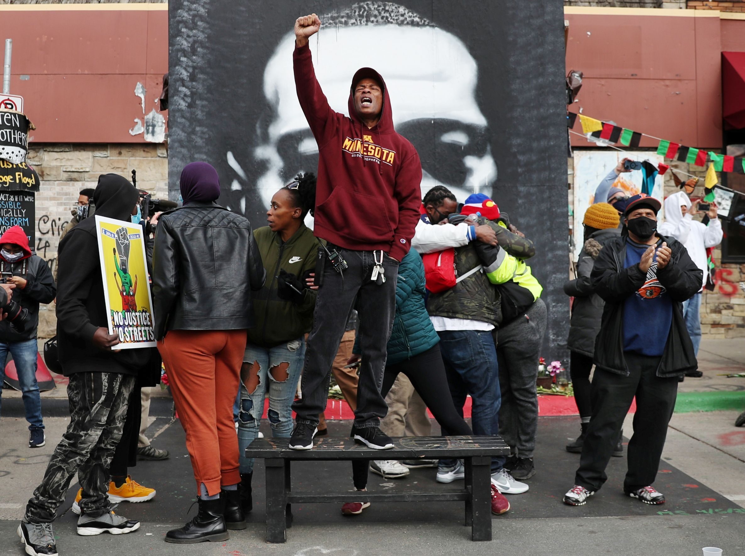 People react after the verdict in the trial of former Minneapolis police officer Derek Chauvin, found guilty of the death of George Floyd, at George Floyd Square in Minneapolis, Minnesota, U.S., April 20, 2021.