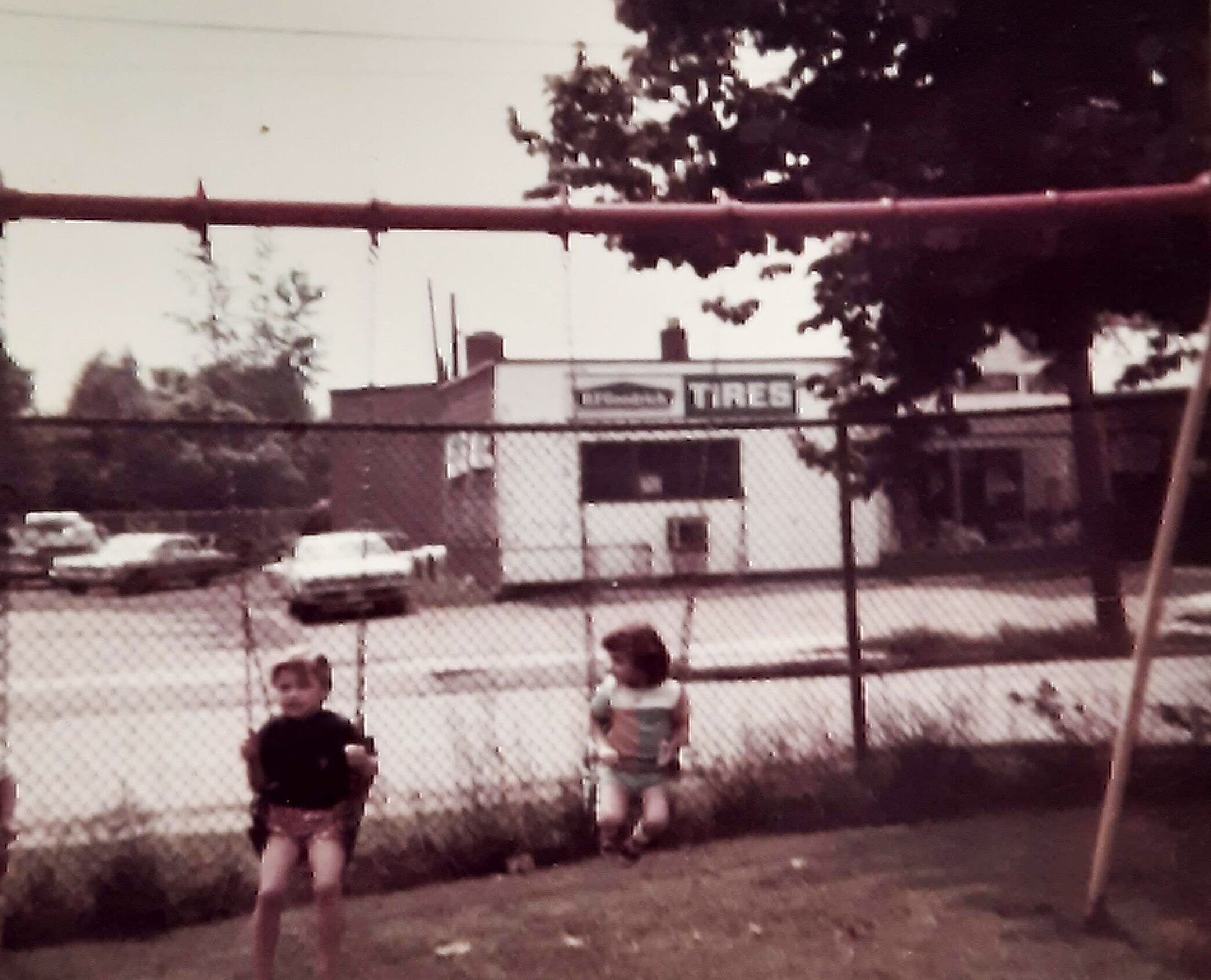 Bobbi Dempsey, around 4 years old, at center, with her 6-year-old brother Joey on a playground near their childhood home in northeast Pennsylvania.