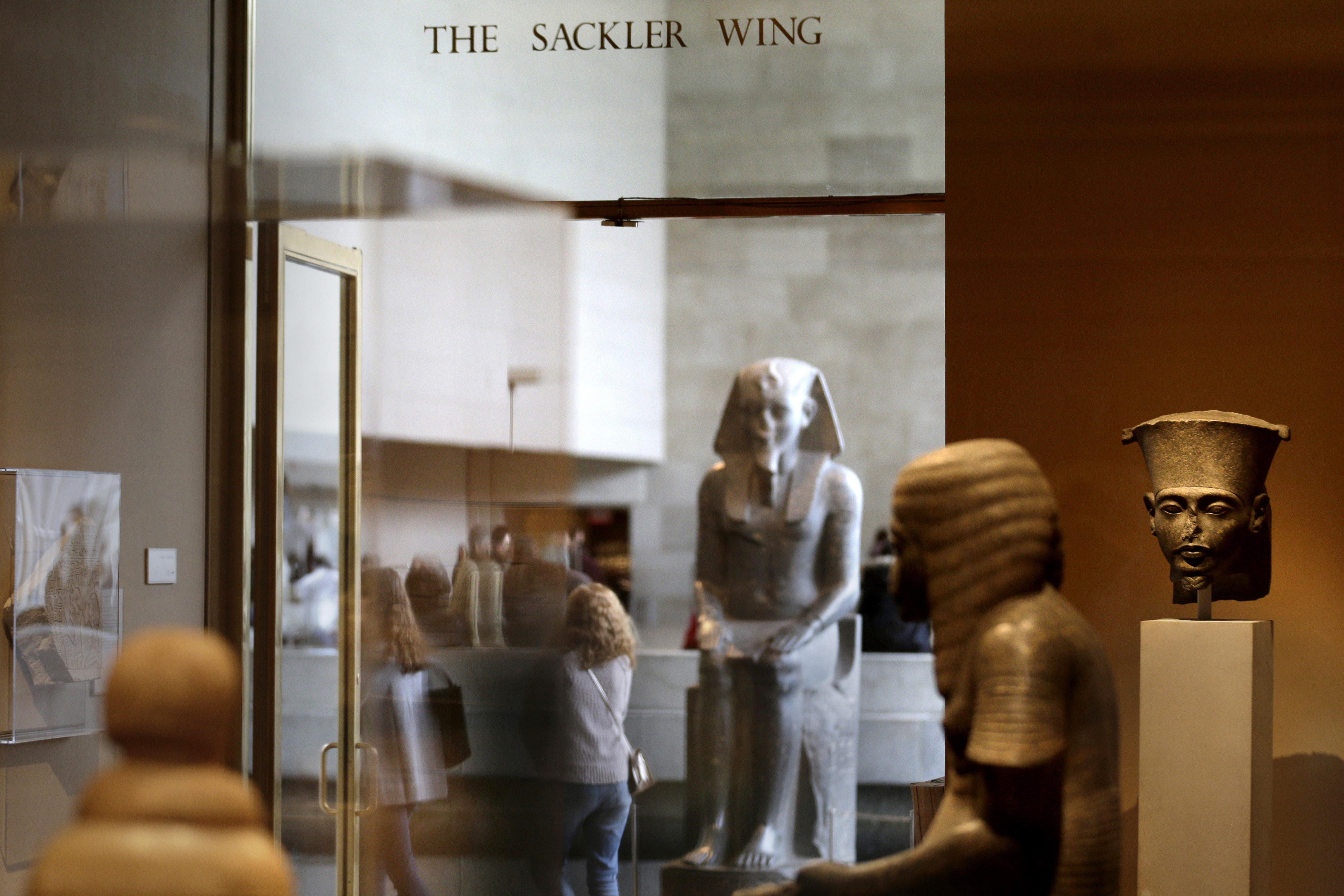This Thursday, Jan. 17, 2019, file photo shows a sign reading “The Sackler Wing” at The Metropolitan Museum of Art in New York. 