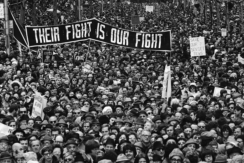 (Original Caption) These are some of the estimated 100,000 persons who gathered at Hammarskjold Plaza in front of the United Nations April 15th during the fourth annual parade-rally held under the auspices of the Greater New York Conference on Soviet Jewry. Speakers called for the Soviet Union to grant Jews the “basic rights” to emigrate to Israel and to practice their Judaism.