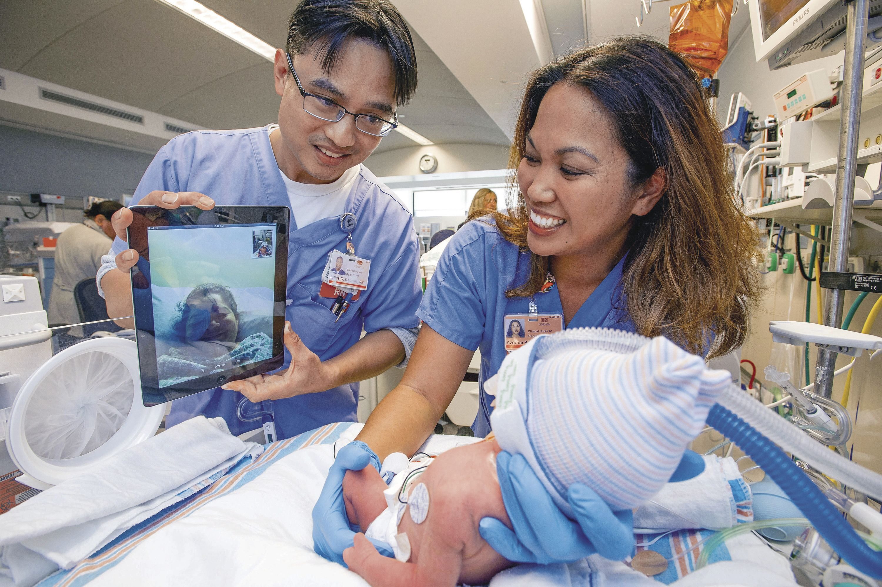 Stories from grateful parents about the care their children received in Cedars-Sinai’s neonatal intensive care unit helped inspire campaign gifts. Here, nurses Julius Caceres and Yvonne Kidder help a mother connect with her baby on FaceTime.