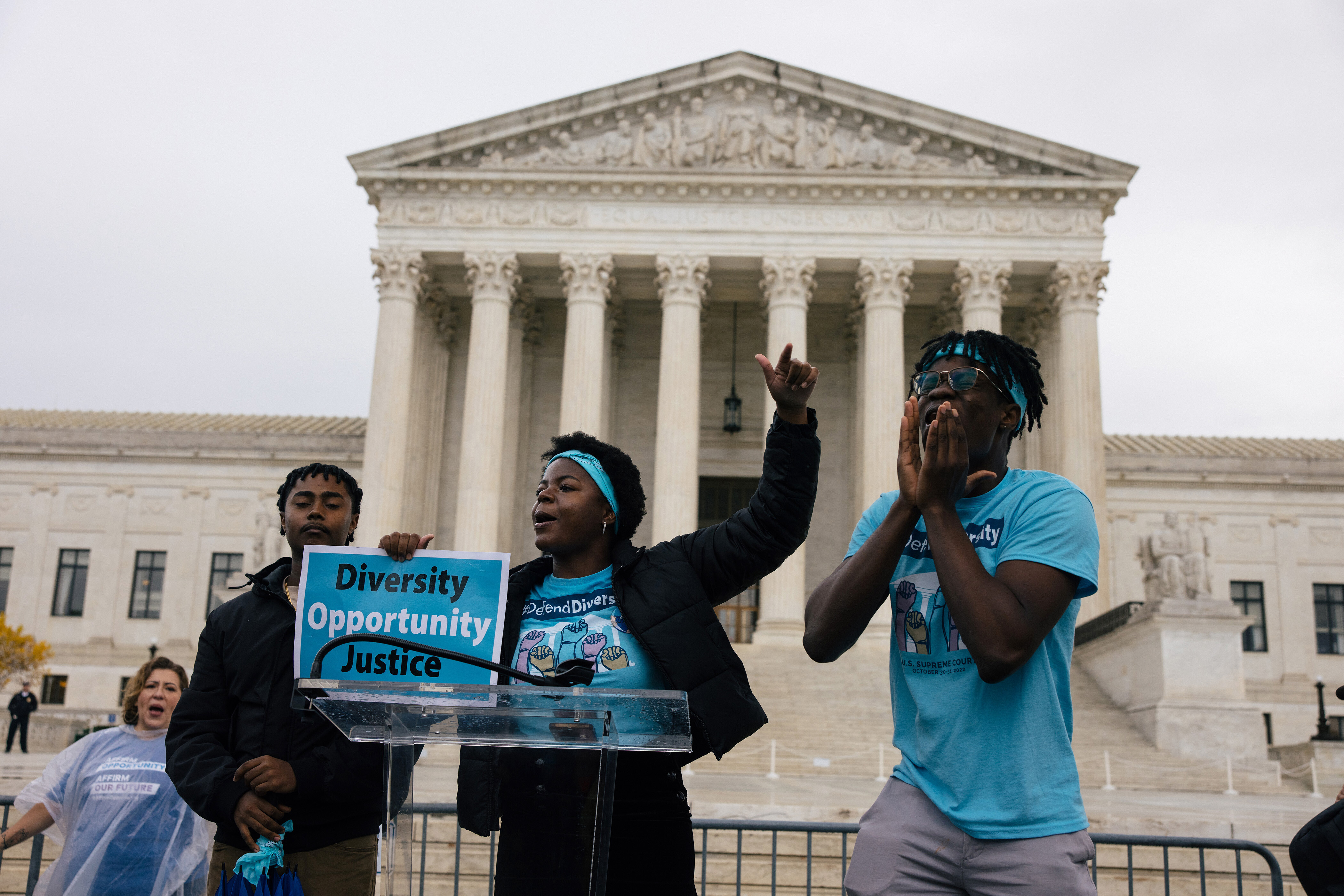 From left, Harvard students Jonathan Haileselassie, Elizabeth Ogolo and David Lewis lead Harvard students and others as the Supreme Court hears oral arguments in an affirmative action lawsuit against Harvard University.