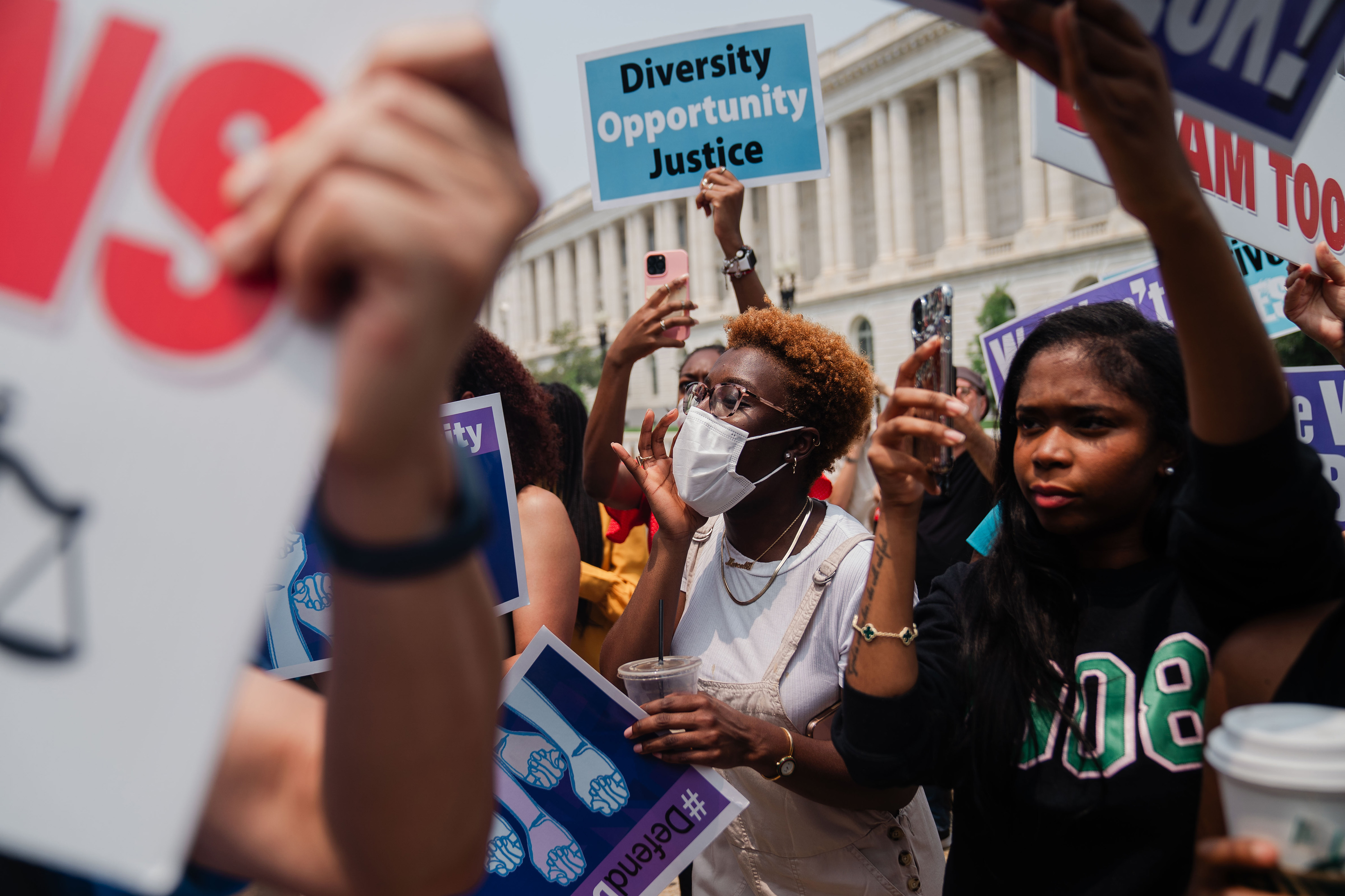 WASHINGTON, DC: Pro Affirmative Action supporters and and counter protestors shout at each outside of the Supreme Court of the United States on Thursday, June 29, 2023 in Washington, DC. In a 6-3 vote, Supreme Court Justices ruled that race-conscious admissions programs at Harvard and the University of North Carolina are unconstitutional, setting precedent for affirmative action in other universities and colleges. (Kent Nishimura, Los Angeles Times, Getty Images)