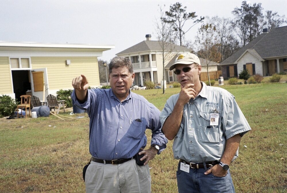 Alberto Ibargüen (left), president of the John S. and James L. Knight Foundation surveys damage in Mississippi after Hurricane Katrina.