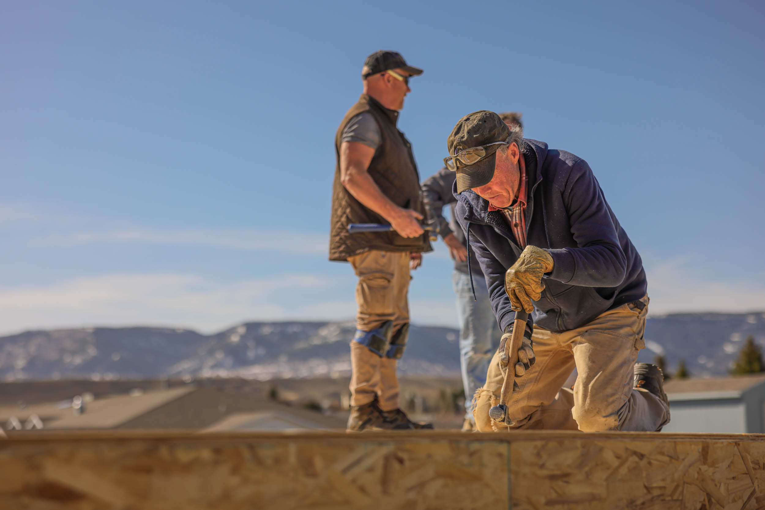 Volunteers for Habitat for Humanity, The Heart of Wyoming, work to build houses in Casper, Wyoming in January 2022.