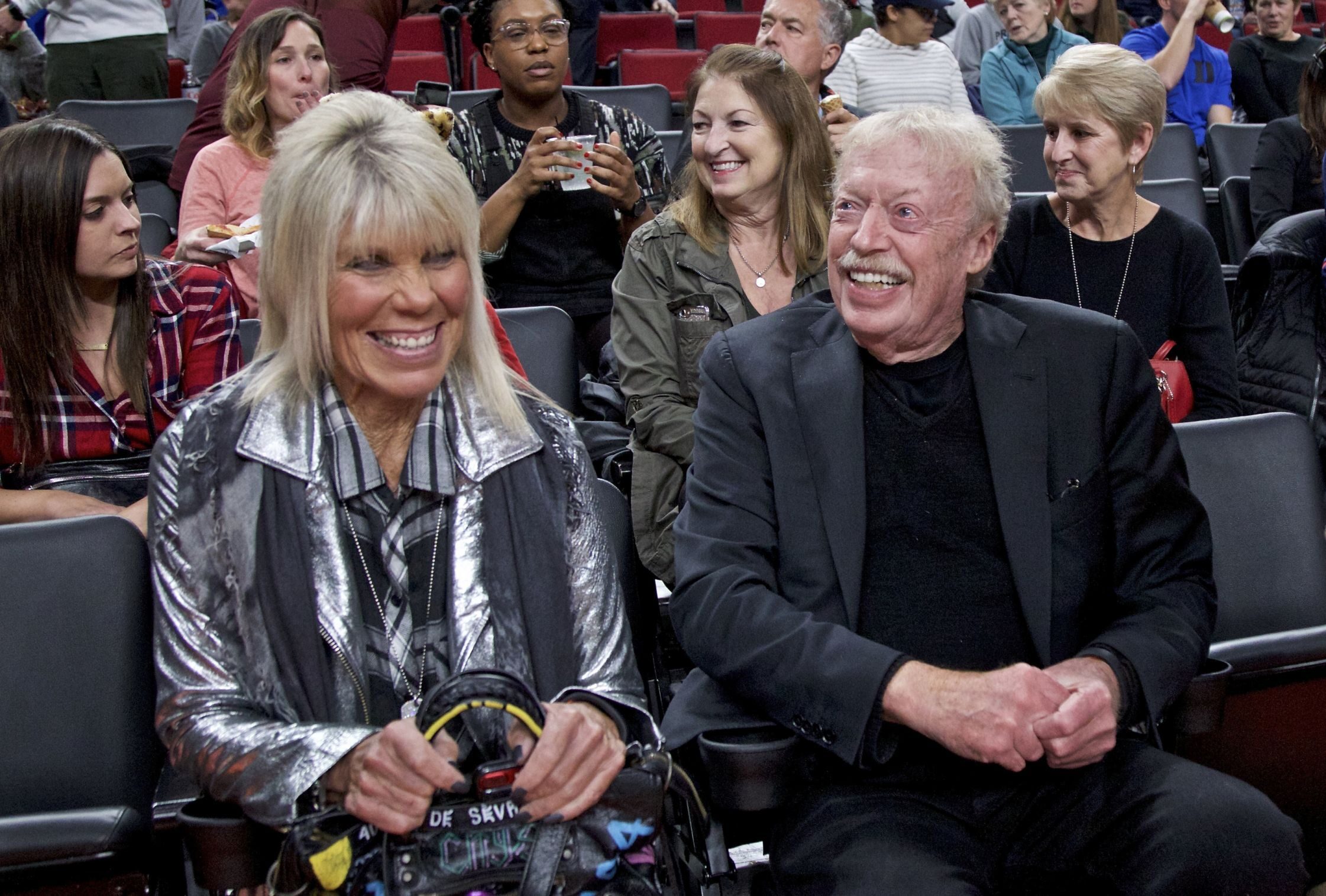 Phil Knight, right, and Penny Knight, left, during the first half of an NCAA college basketball game in the Phil Knight Invitational tournament in Portland, Ore., Sunday, Nov. 26, 2017.