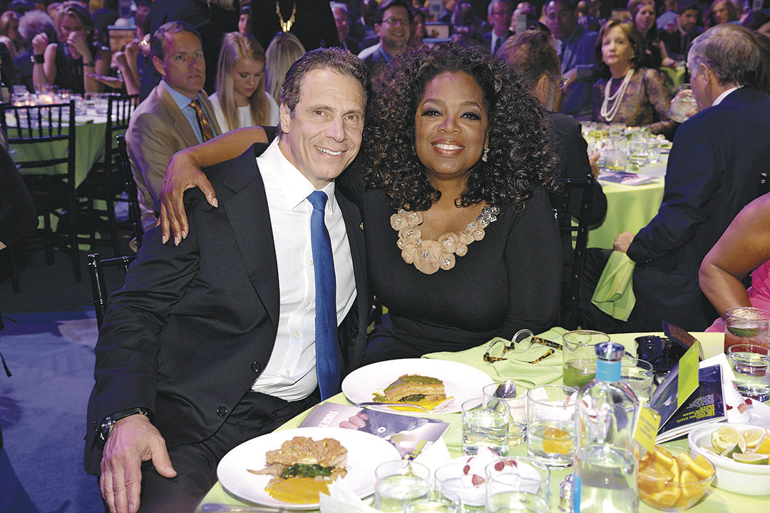 New York Governor Andrew Cuomo and Oprah Winfrey at a record-setting Robin Hood Foundation gala. 