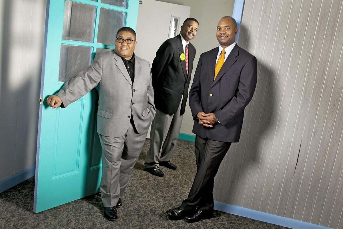 Keith Shannon (left) and Linsey Mills (right) are members of a North Carolina giving circle that supports local charities like Community Success Initiative, led by Dennis Gaddy.