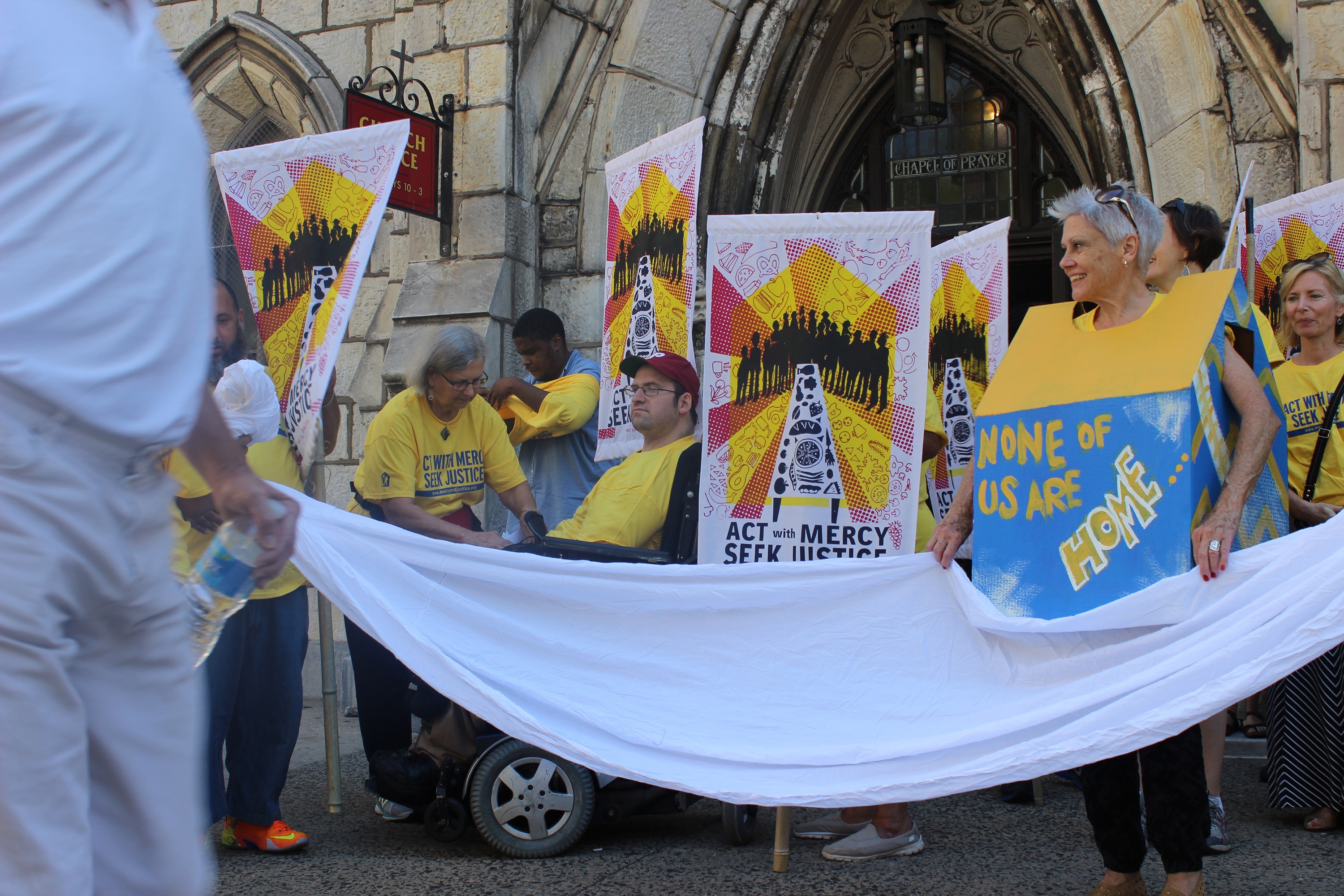 ProjectHome volunteer Pat Suplee, right, wearing the cardboard house, was one of about 80 people who took the streets in Philadelphia Thursday to raise money and awareness for the Francis Fund, a $1.4 million fundraising effort that will benefit the homeless.