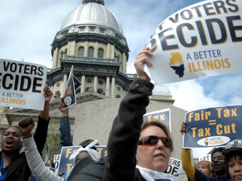 Protesters call for an Illinois progressive income tax outside the state Capitol in Springfield six years ago. ()