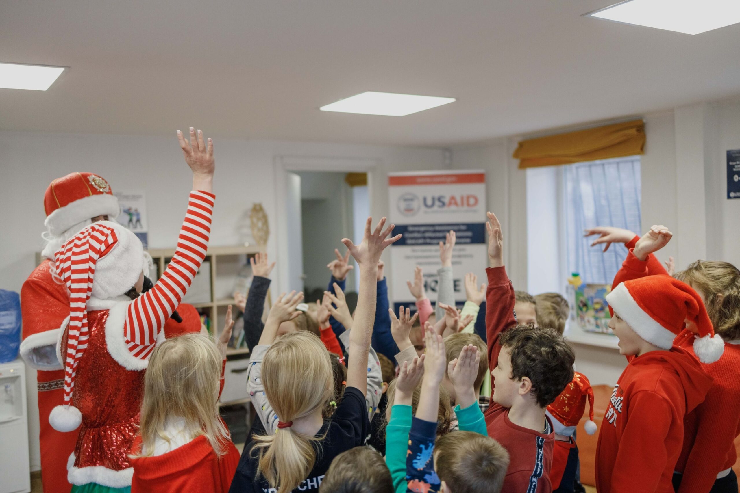 Children celebrate St. Nicolas Day at the Dnipro MHPSS Center in Ukraine on December 5, 2023. The support is provided within the Emergency Assistance for Conflict-affected Populations (EACAP) Program thanks to the generous support of the American people implemented by Project HOPE and provided through the USAID Bureau of Humanitarian Assistance (BHA).