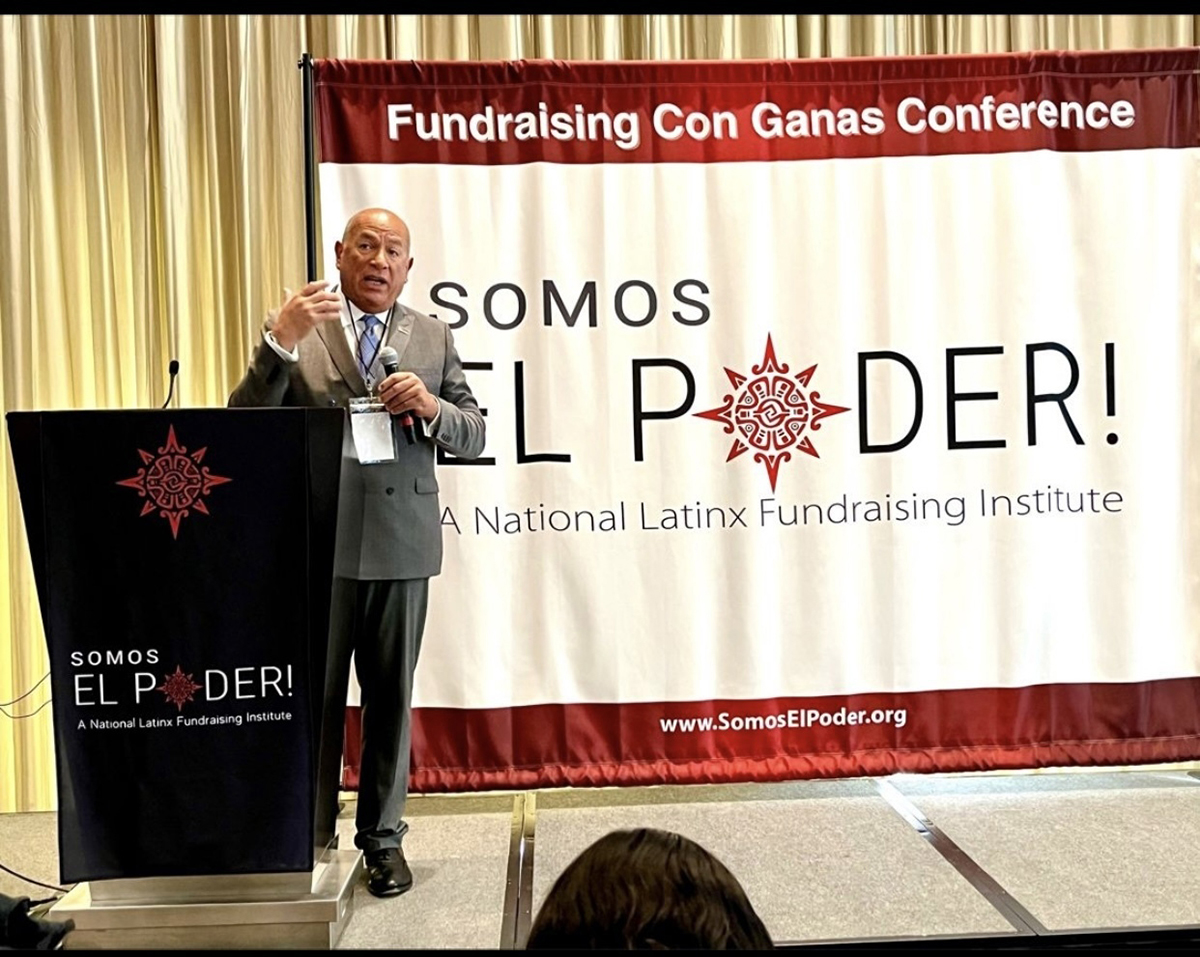 Somos El Poder founder Armando Zumaya speaks at the group’s recent conference in Chicago. (Jesus Menera)