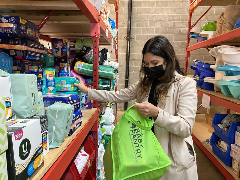 A person gets items at the Greater DC Diaper Bank warehouse in Silver Spring, MD.