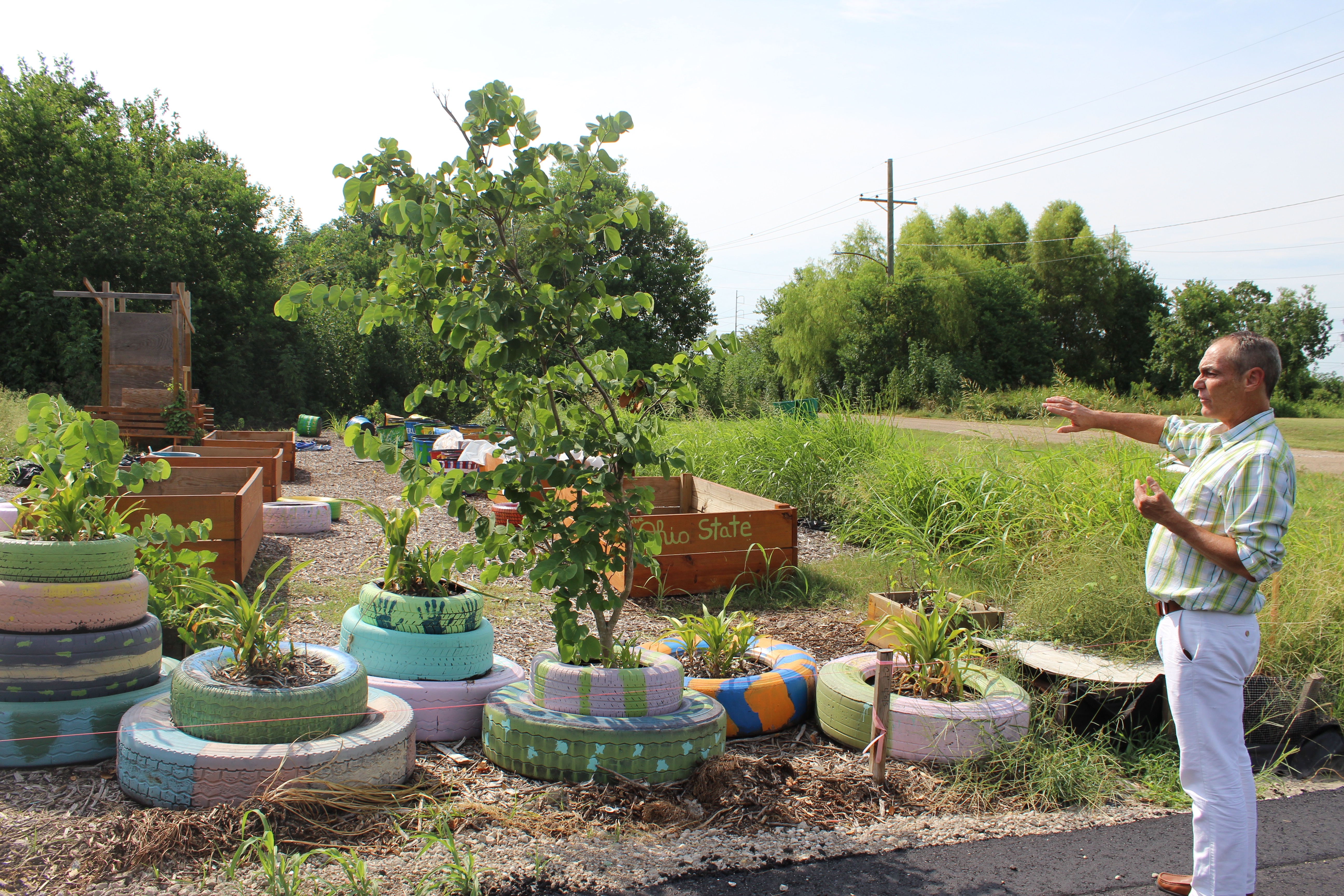 Christopher Cameron, head of HandsOn New Orleans, explains the layout of a community garden the volunteer-focused group started in the Lower Ninth Ward. Nonprofit leaders launched an appreciation campaign to thank donors, nonprofits, and volunteers for their help after Hurricane Katrina.