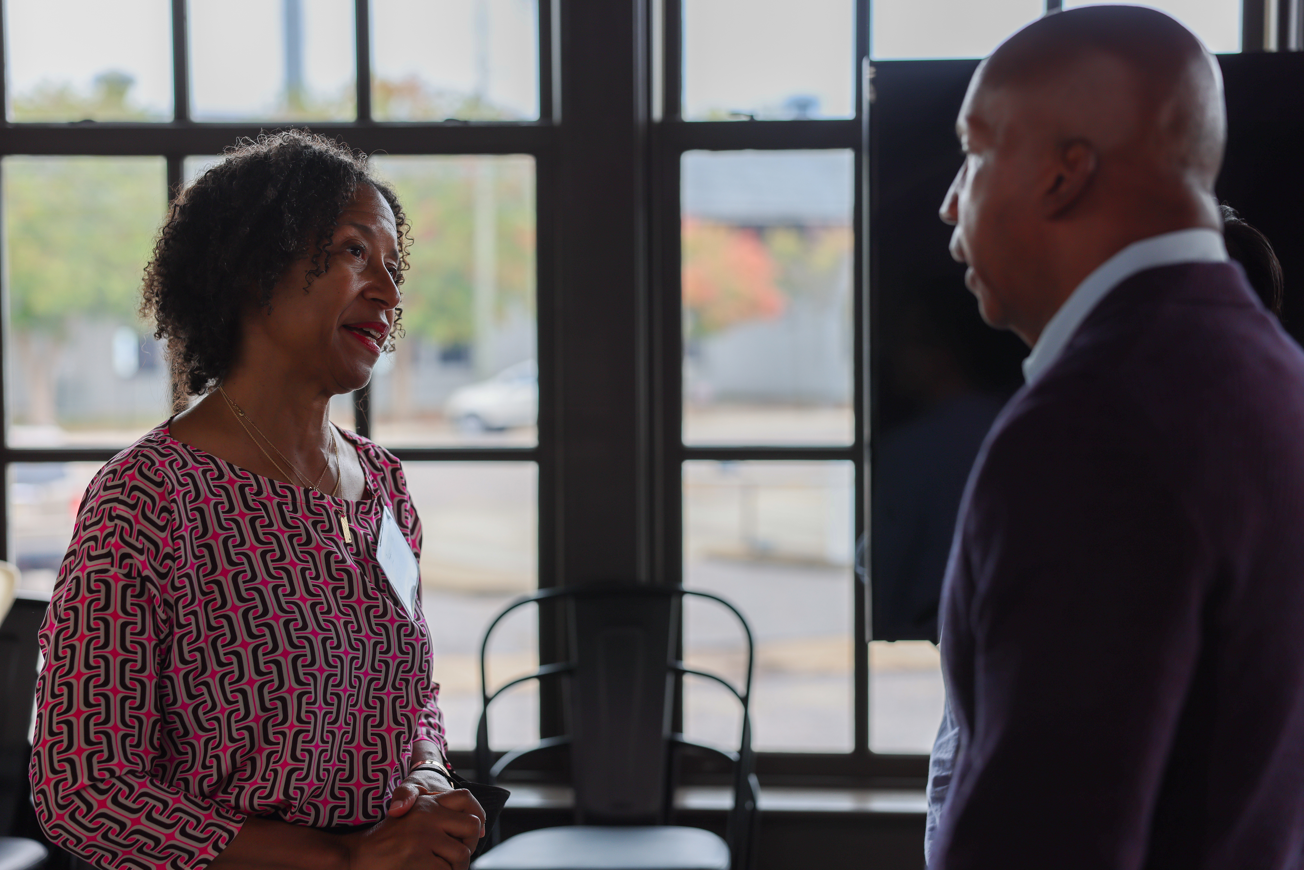 Crystal Hayling, executive director of Libra Foundation, speaks with Bryan Stevenson, Executive Director of the Equal Justice Initiative, during a Libra Foundation trip to Montgomery. (Jean Melesaine, Libra Foundation)