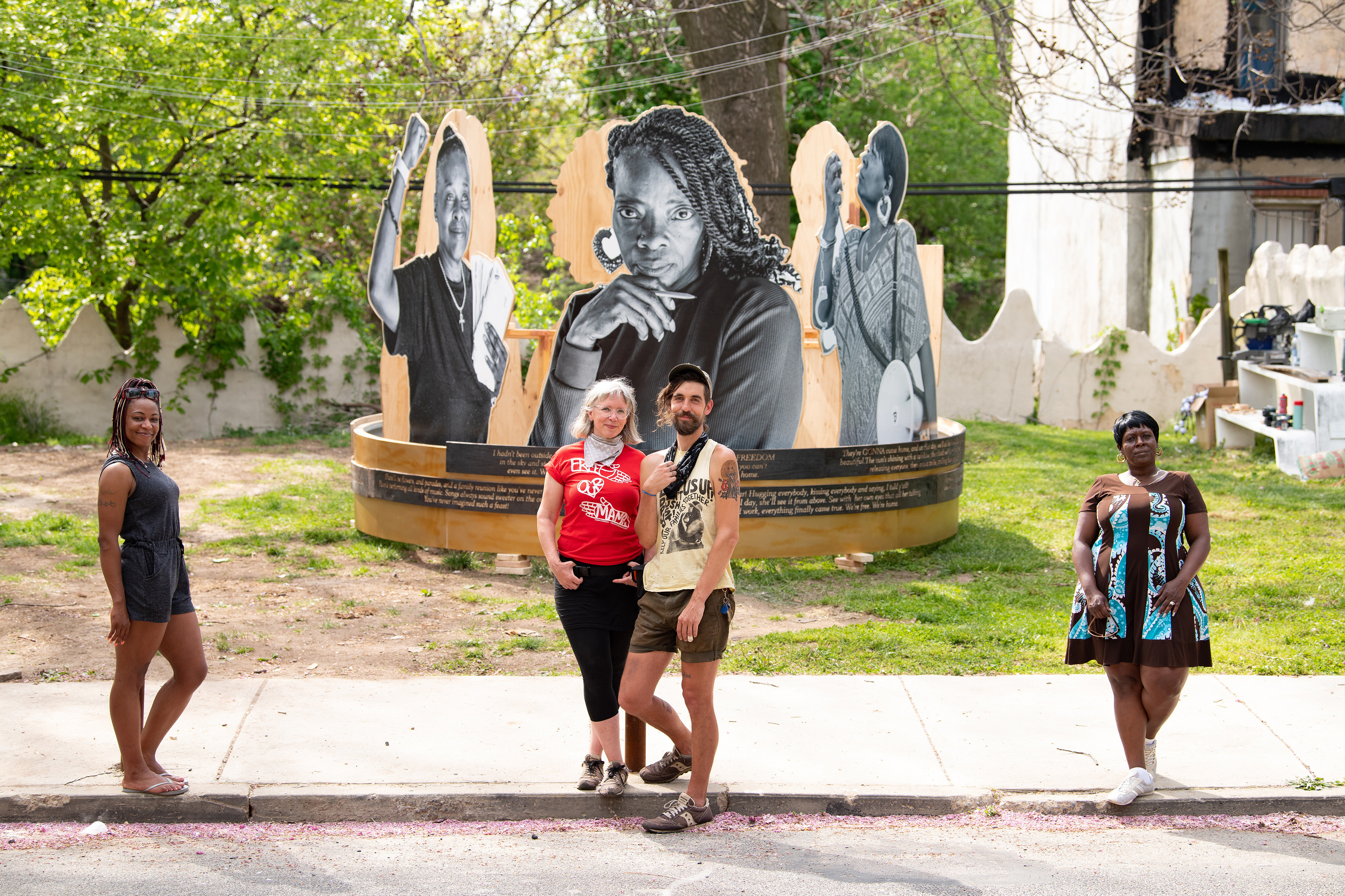 From left, Tamika Bell, Courtney Bowles, Mark Strandquist and Ivy Johnson in front of their artwork “On the Day They Come Home,” a sculpture in the exhibition “Staying Power,” featuring five women who are fighting to end life sentences, in Philadelphia, April 28, 2021. Bowles and Strandquist collaborated with the five women to create the installation.