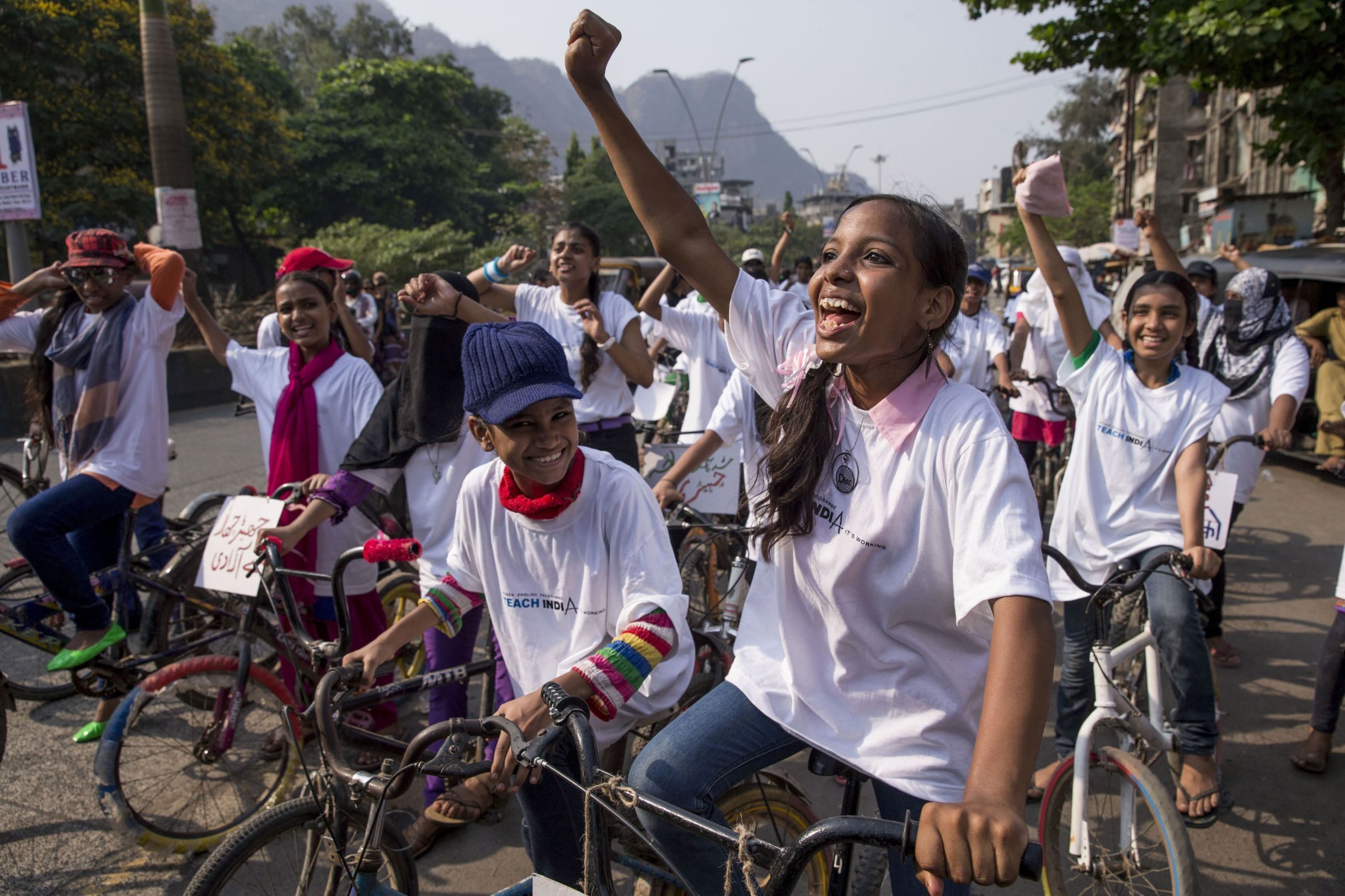 MUMBRA, INDIA - MARCH 27: A muslim women’s bicycle rally organized by Aawaaz Foundation, displaying messages to help sensitize the community towards women’s issues and rights. March 27, 2015 in Mumbra, India (Jonathan Torgovnik, AJWS)