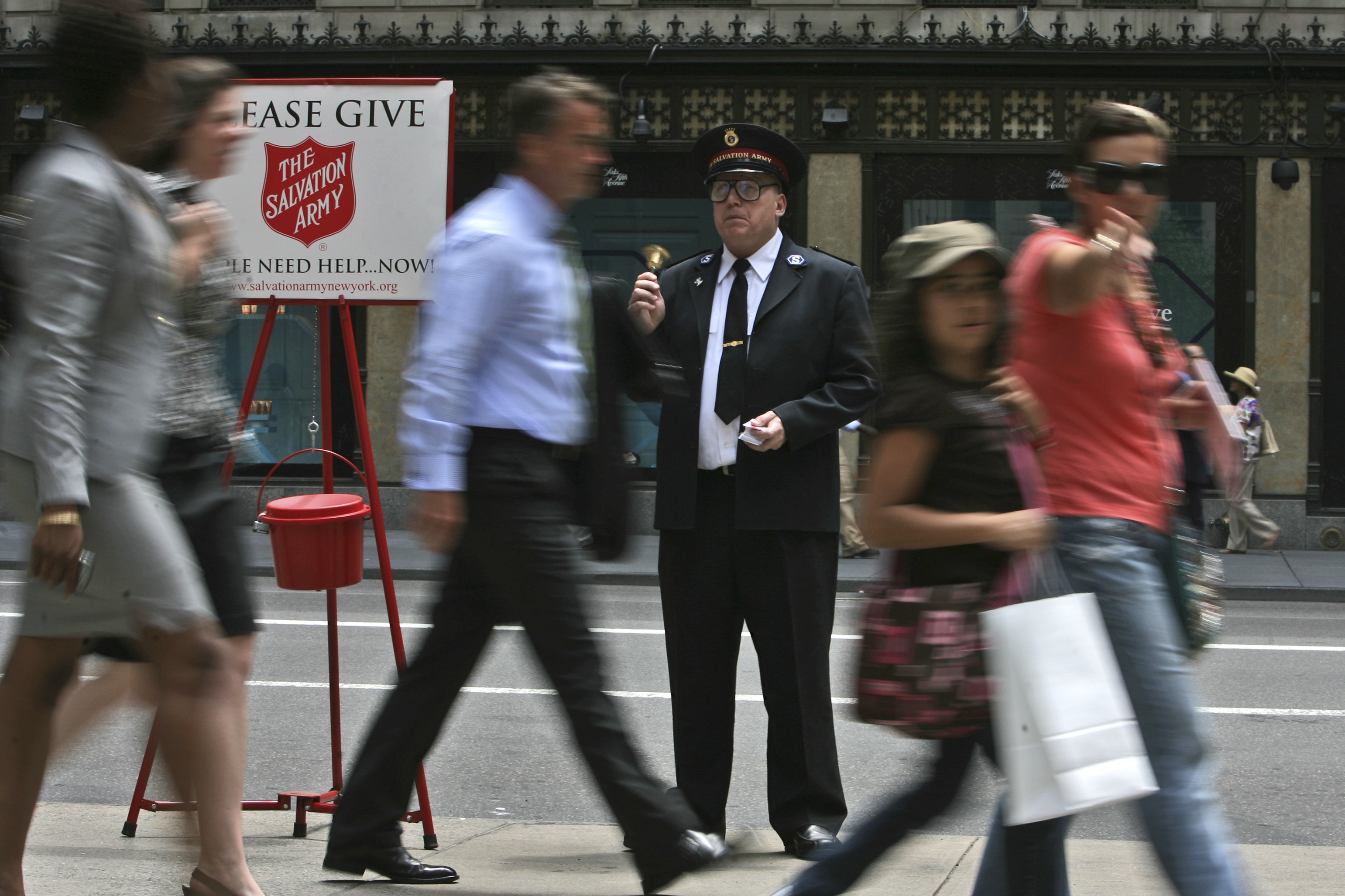Salvation Army Soldier Daniel Aherns collects donations on 5th Avenue at Rockefeller Center in New York.