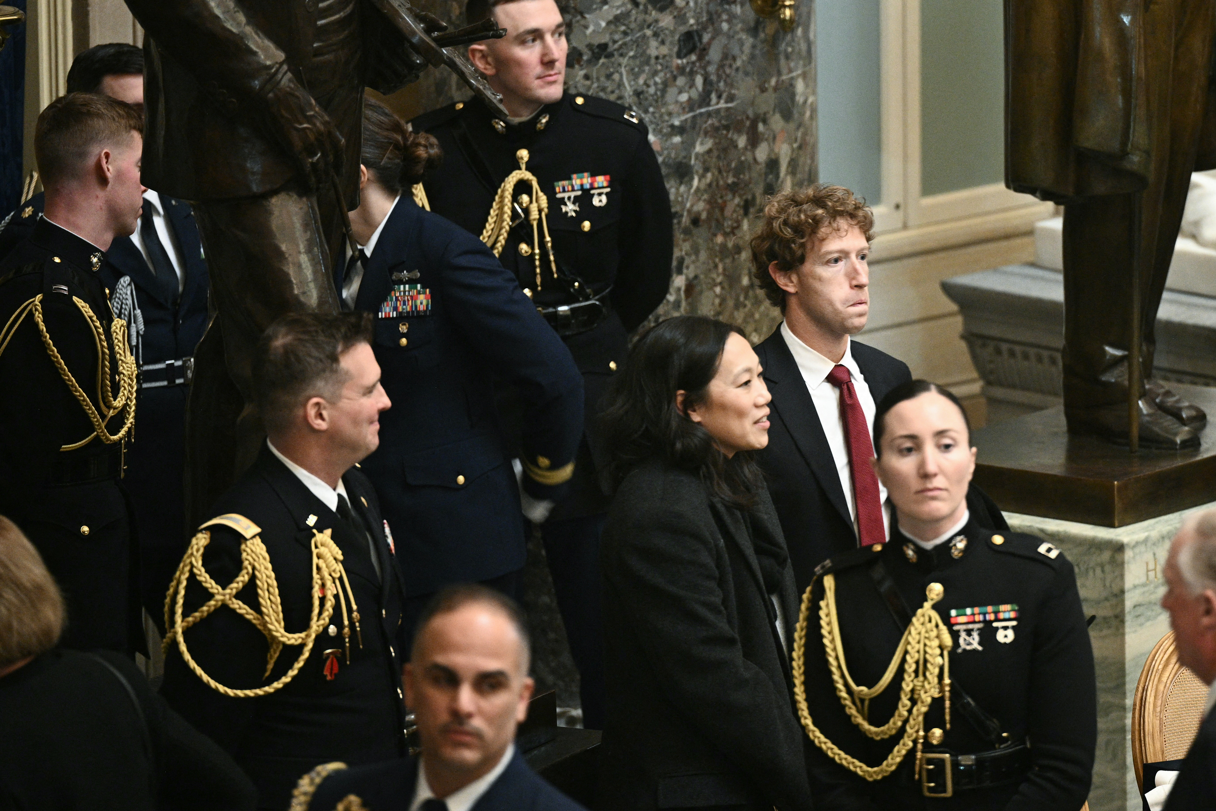 Mark Zuckerberg and Priscilla Chan depart a luncheon in honor of President Donald Trump following his inauguration ceremony, in Statuary Hall at the U.S. Capitol in Washington, D.C., on January 20, 2025.