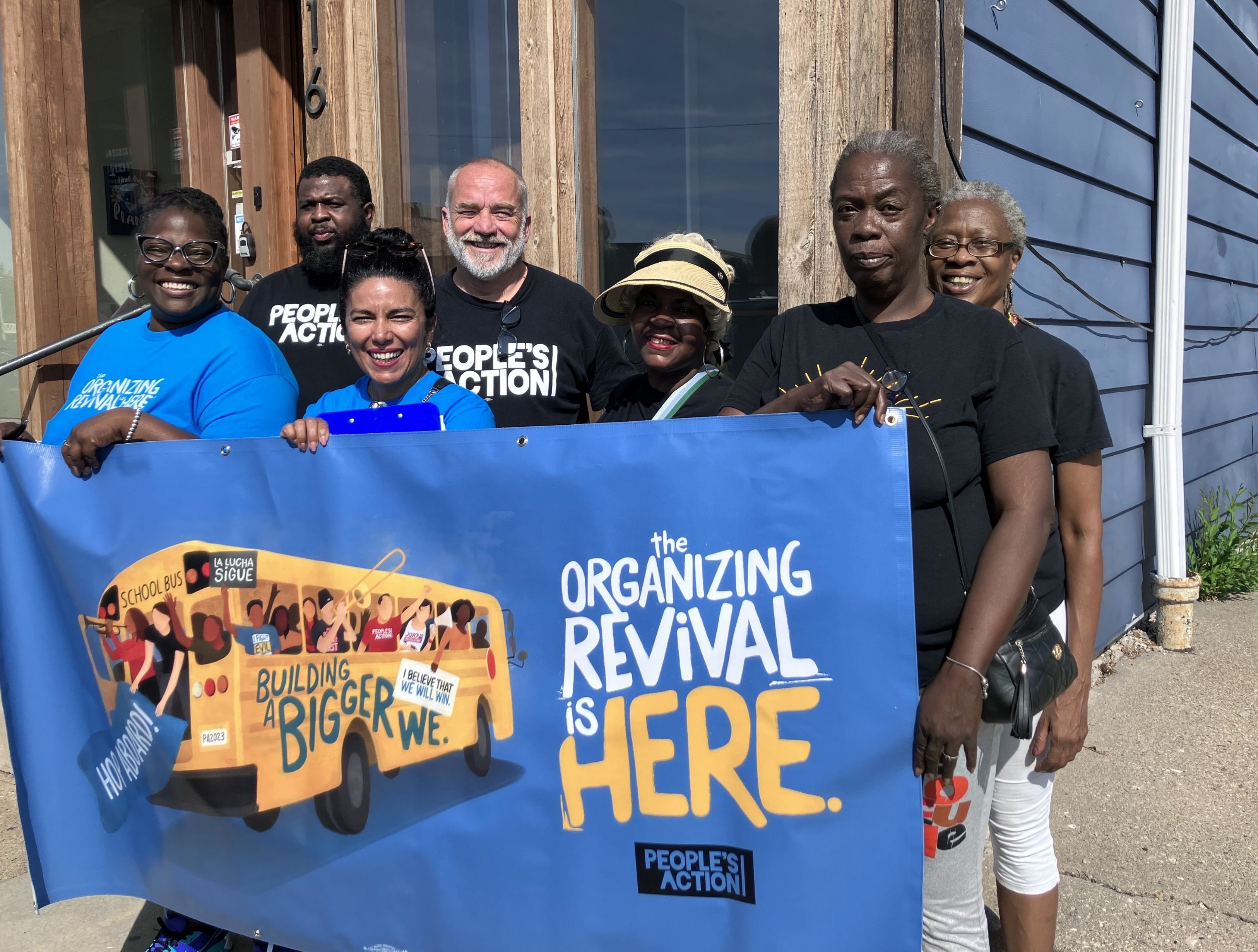 Sulma Arias, second from right, executive director of the People’s Action Institute, poses with volunteers during a canvasing campaign for Building a Bigger We, an initiative to change hearts and minds on immigration in rural and small-town America.