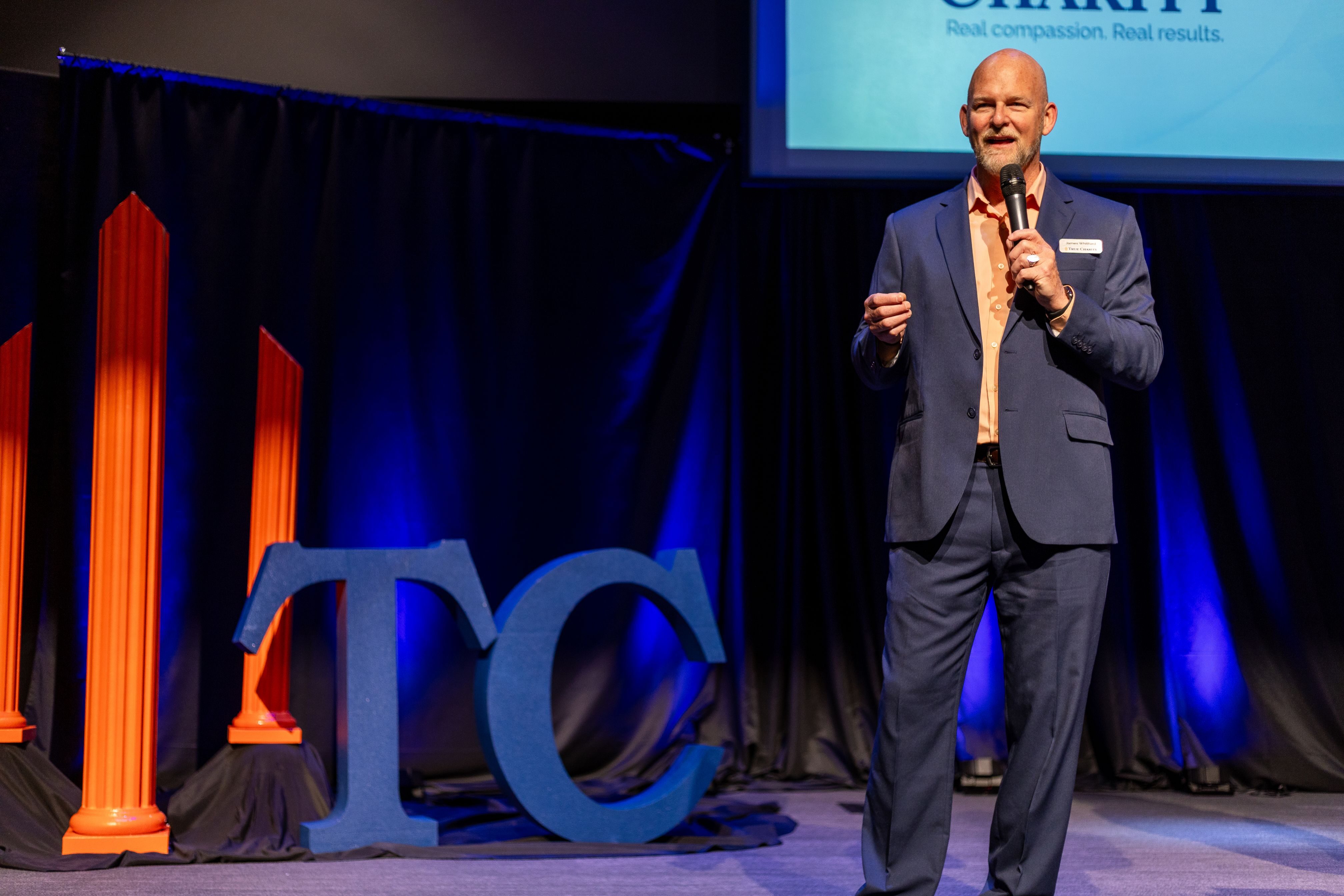 James Whitford, founder and CEO of True Charity, speaks the True Charity Summit at the Northside Christian Church. 