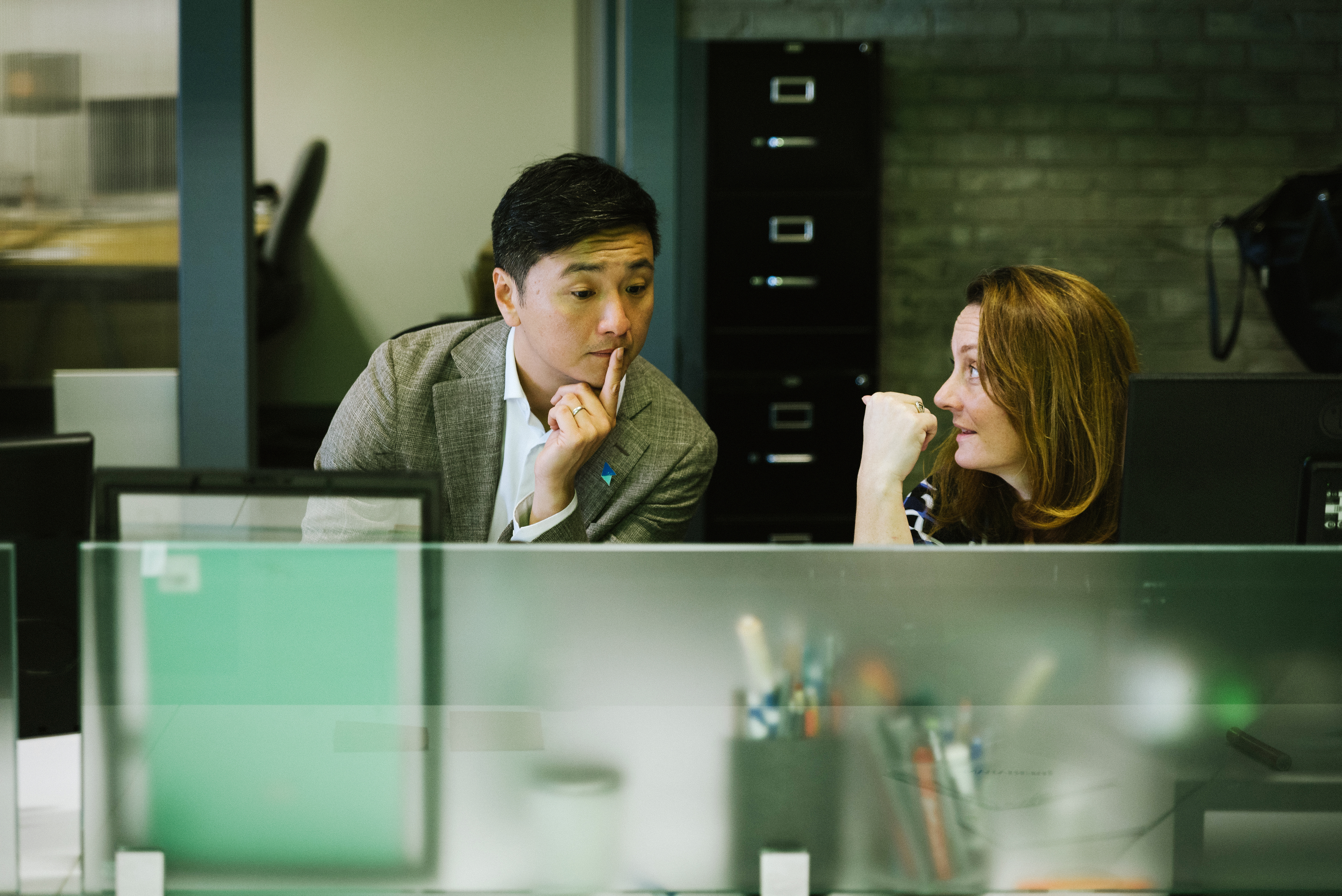 Chong-Hao Fu and senior programming director Sara Neal prepare for an upcoming partner meeting.