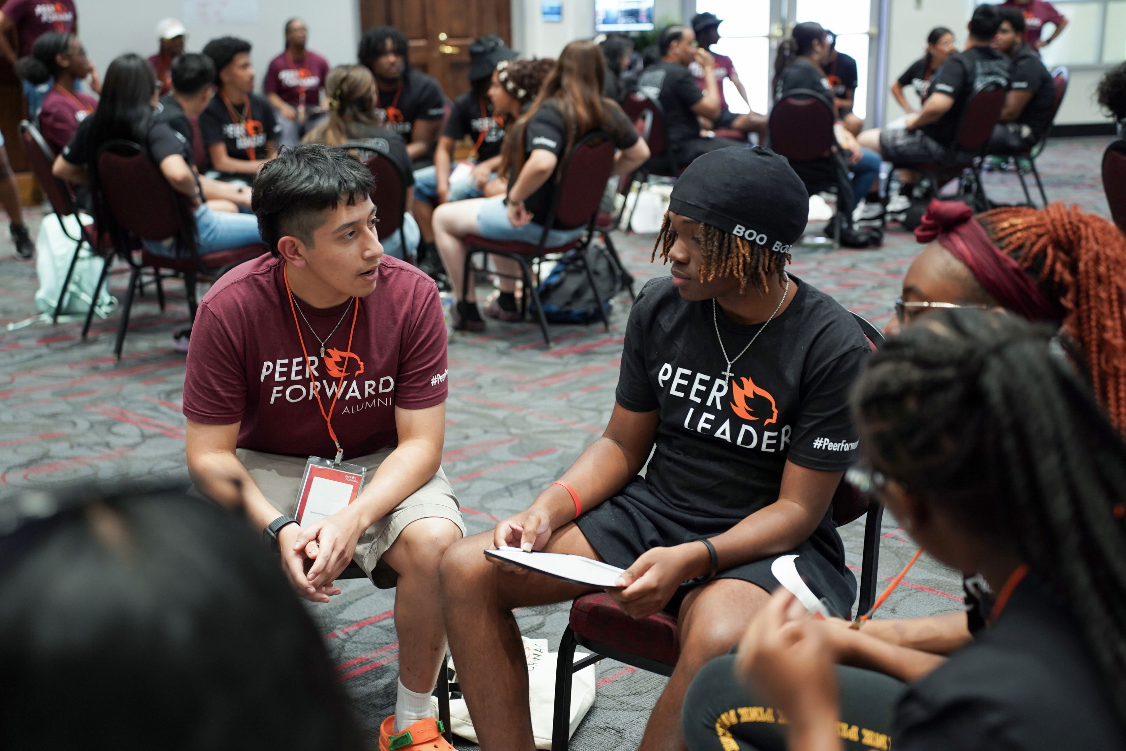 PeerForward alumni and current student leaders in a training session.                               