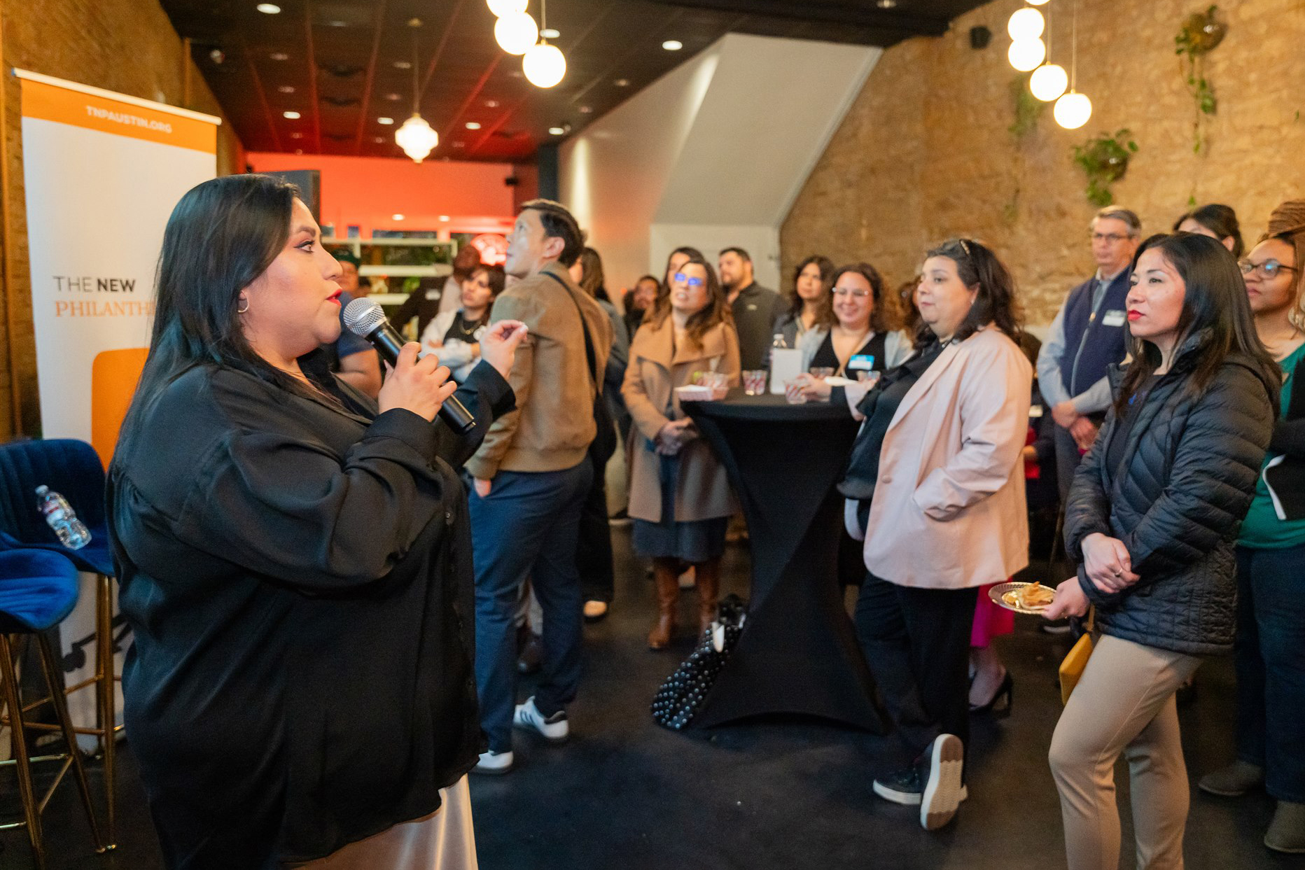 Paulina Artieda speaks at a meeting